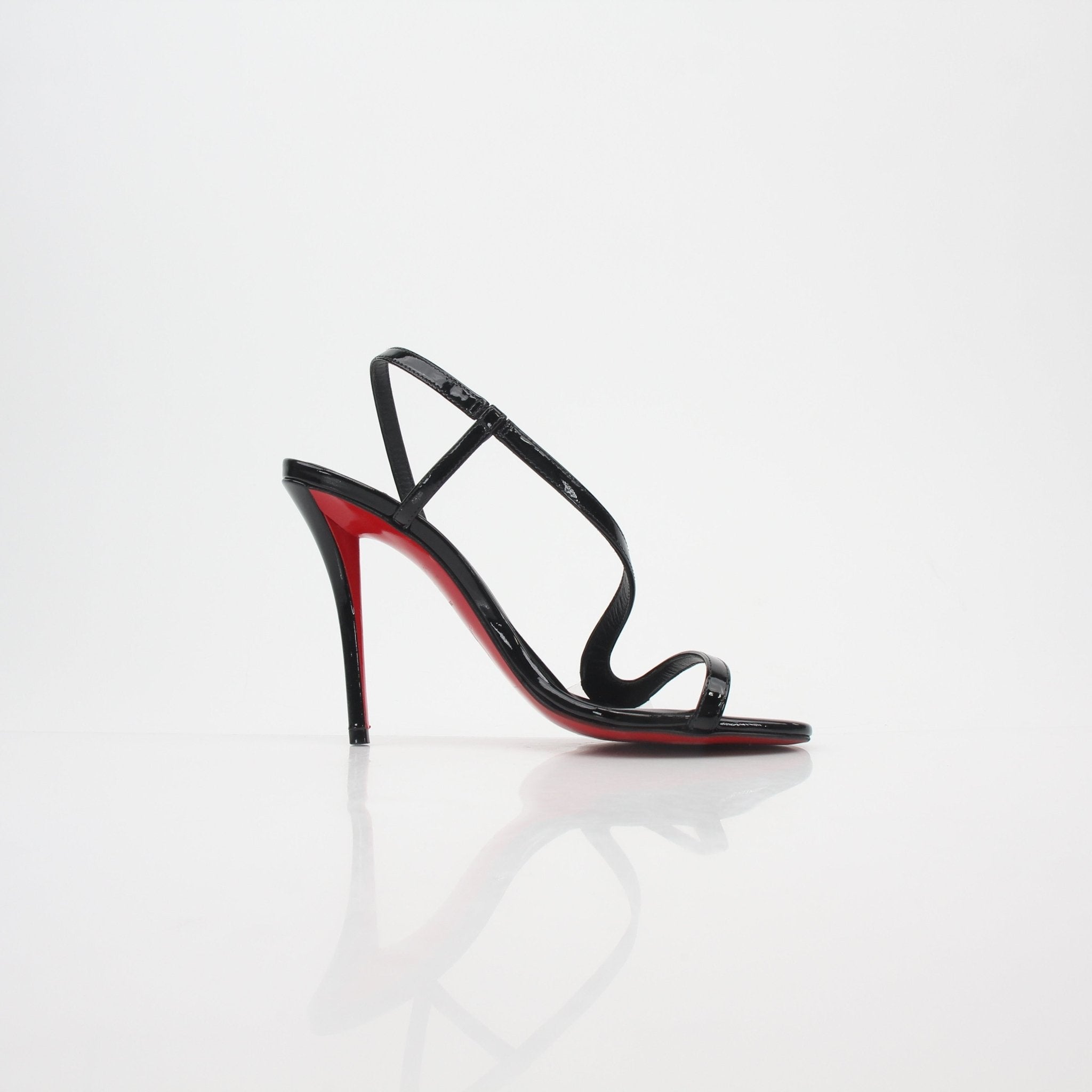 Black Christian Louboutin Rosa Z 100 patent leather sandals with heels, featuring sleek design and signature red sole detail.