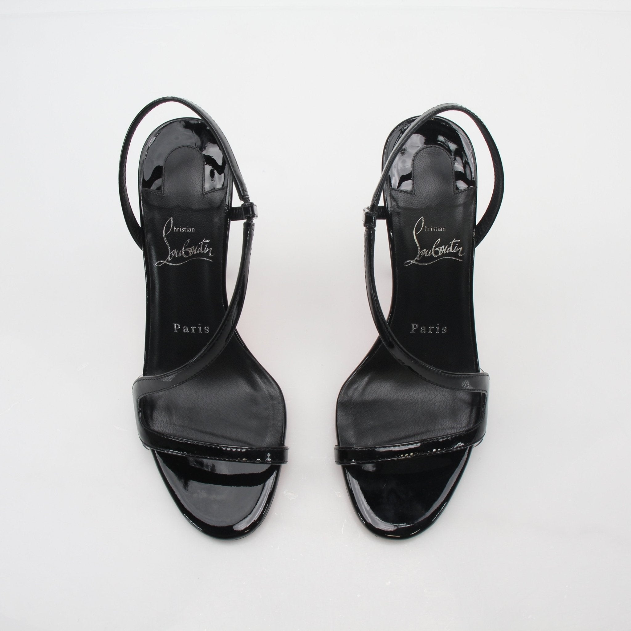 Christian Louboutin Black Rosa Z 100 patent leather heels with red soles and elegant design, showcased on a neutral background.