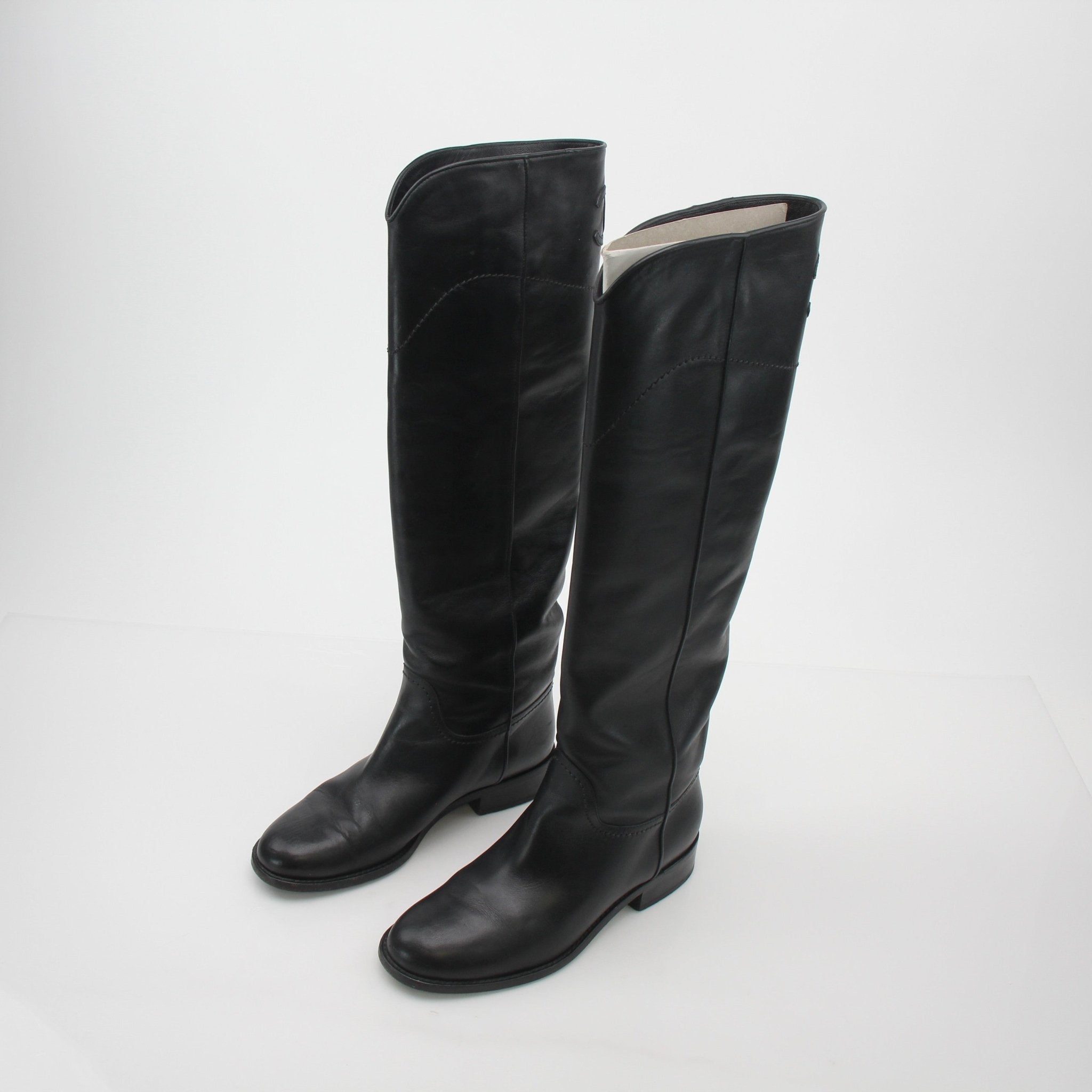 Gold & Beyond Chanel black leather CC knee-high riding boots, stylish shoes with classic design and sleek leather finish.