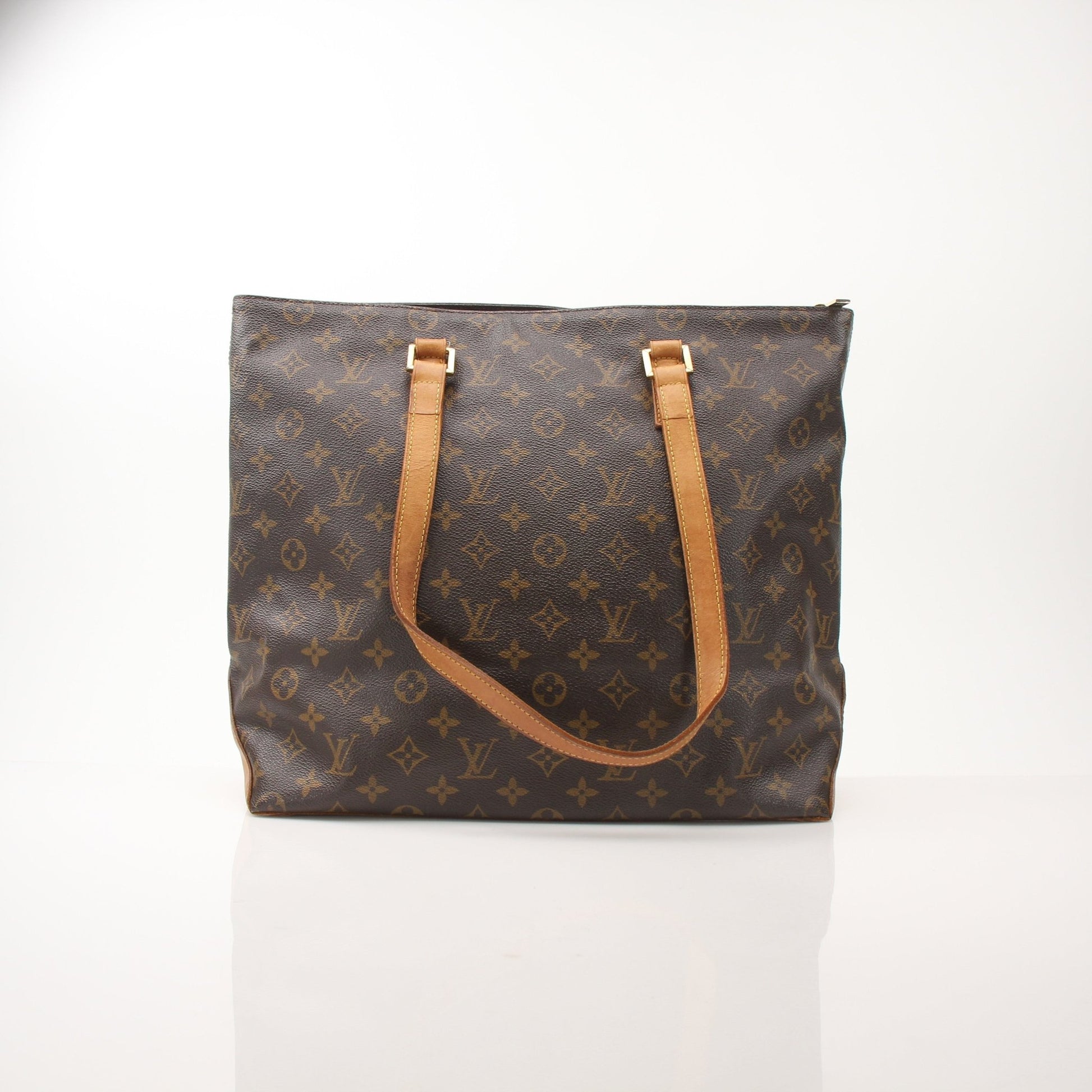 Louis Vuitton Monogram Cabas Piano shoulder tote bag with leather handles and spacious interior, displayed on a neutral background.