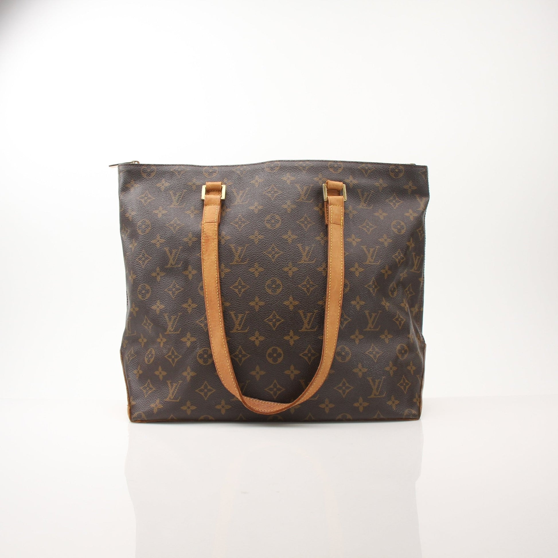 Louis Vuitton Monogram Cabas Piano shoulder tote bag with leather handles and spacious interior, stylish handbag by Gold & Beyond.