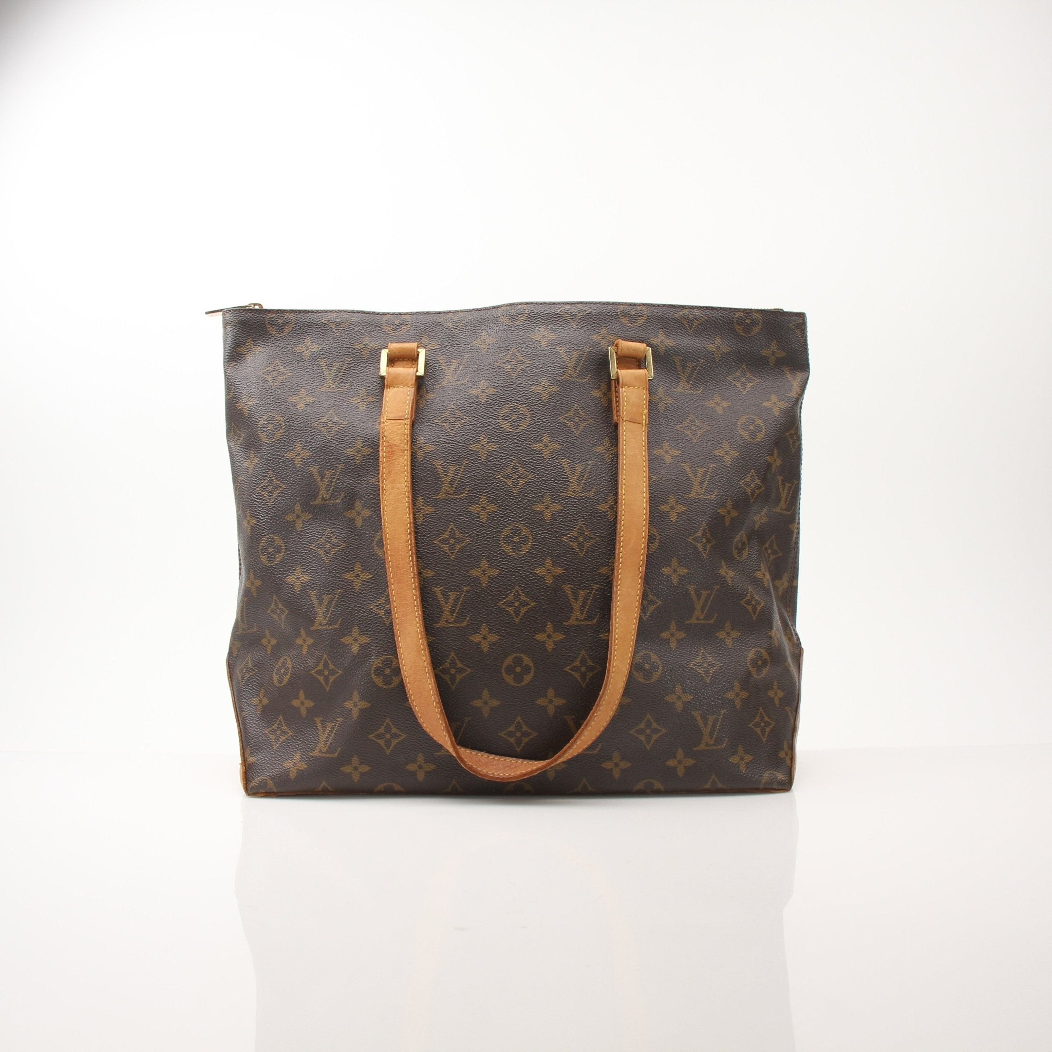 Louis Vuitton Monogram Cabas Piano shoulder tote bag with leather handles and spacious interior, stylish handbag by Gold & Beyond.