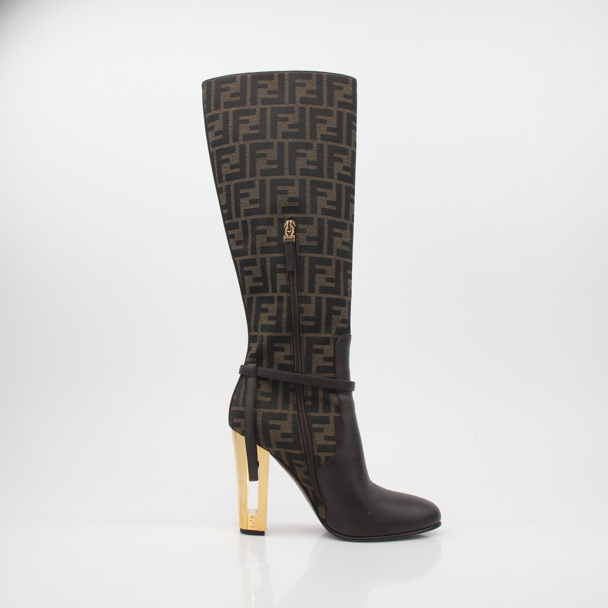 Fendi brown FF Jacquard Delfina knee-high boots with block heels and pointed toes, showcasing intricate jacquard pattern.