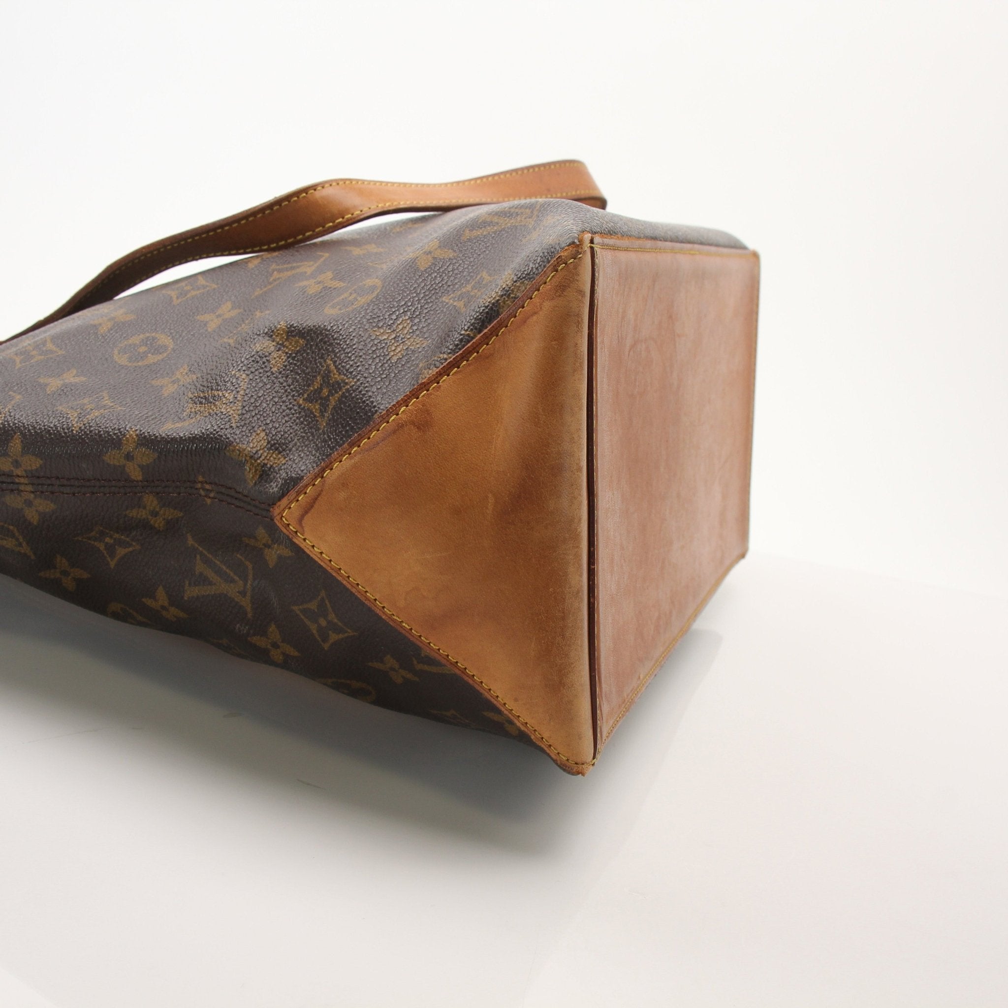 Louis Vuitton Monogram Cabas Piano shoulder tote bag with gold accents, featuring signature monogram canvas and spacious design.