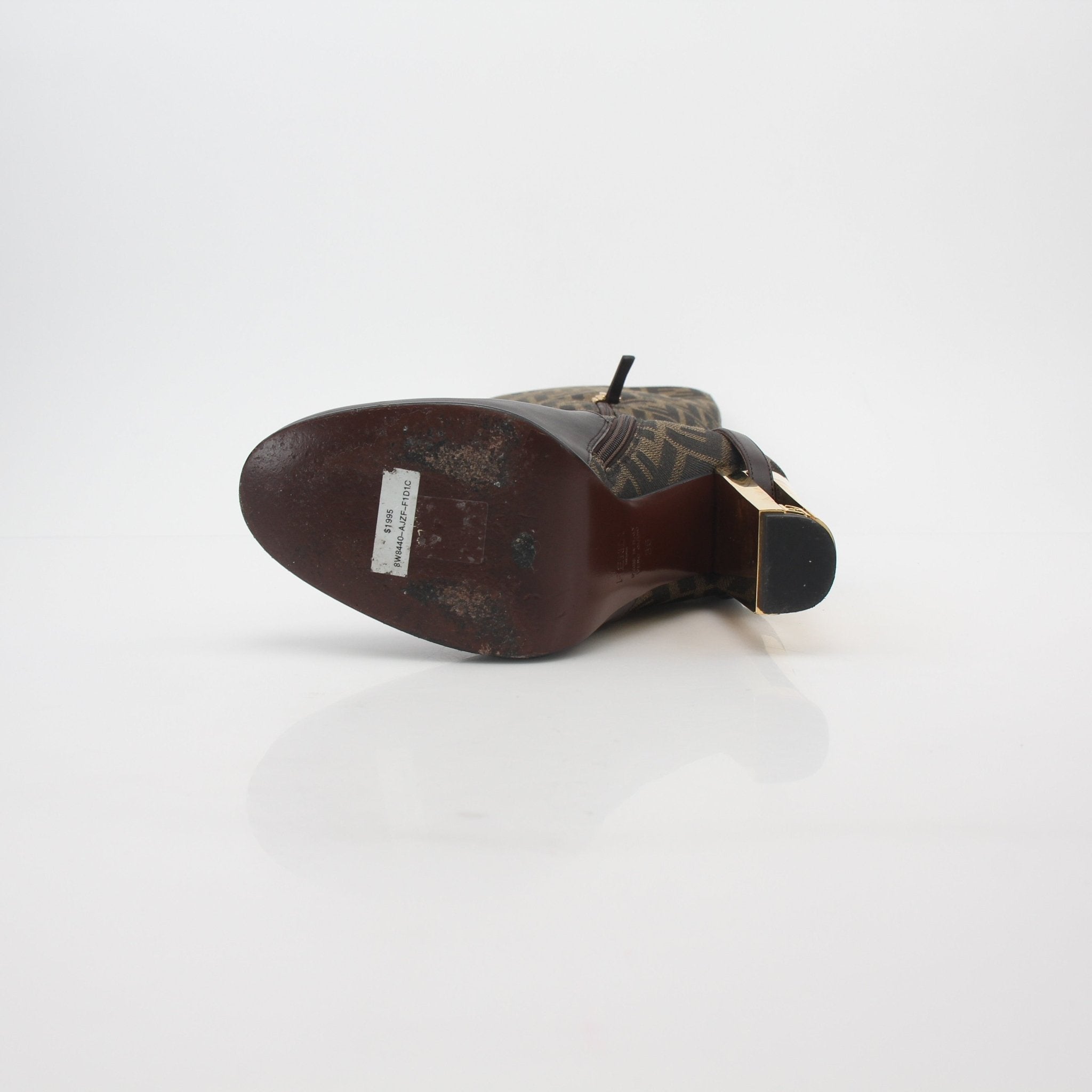 Fendi brown FF Jacquard Delfina knee-high boots with block heels and sleek design, displayed on a neutral background.
