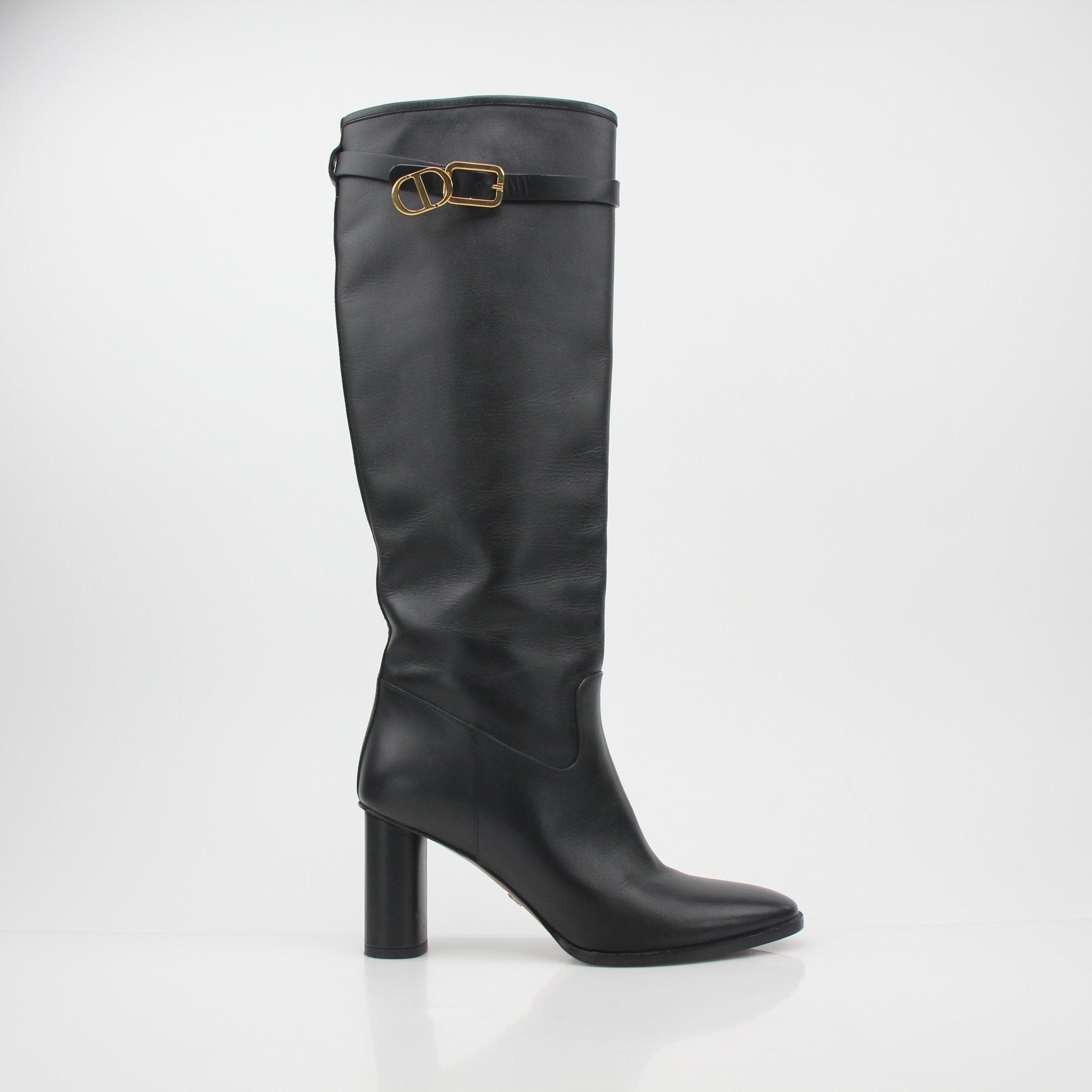 Christian Dior Black Leather Empreinte heeled boots with pointed toes and sleek design, displayed on a neutral background.