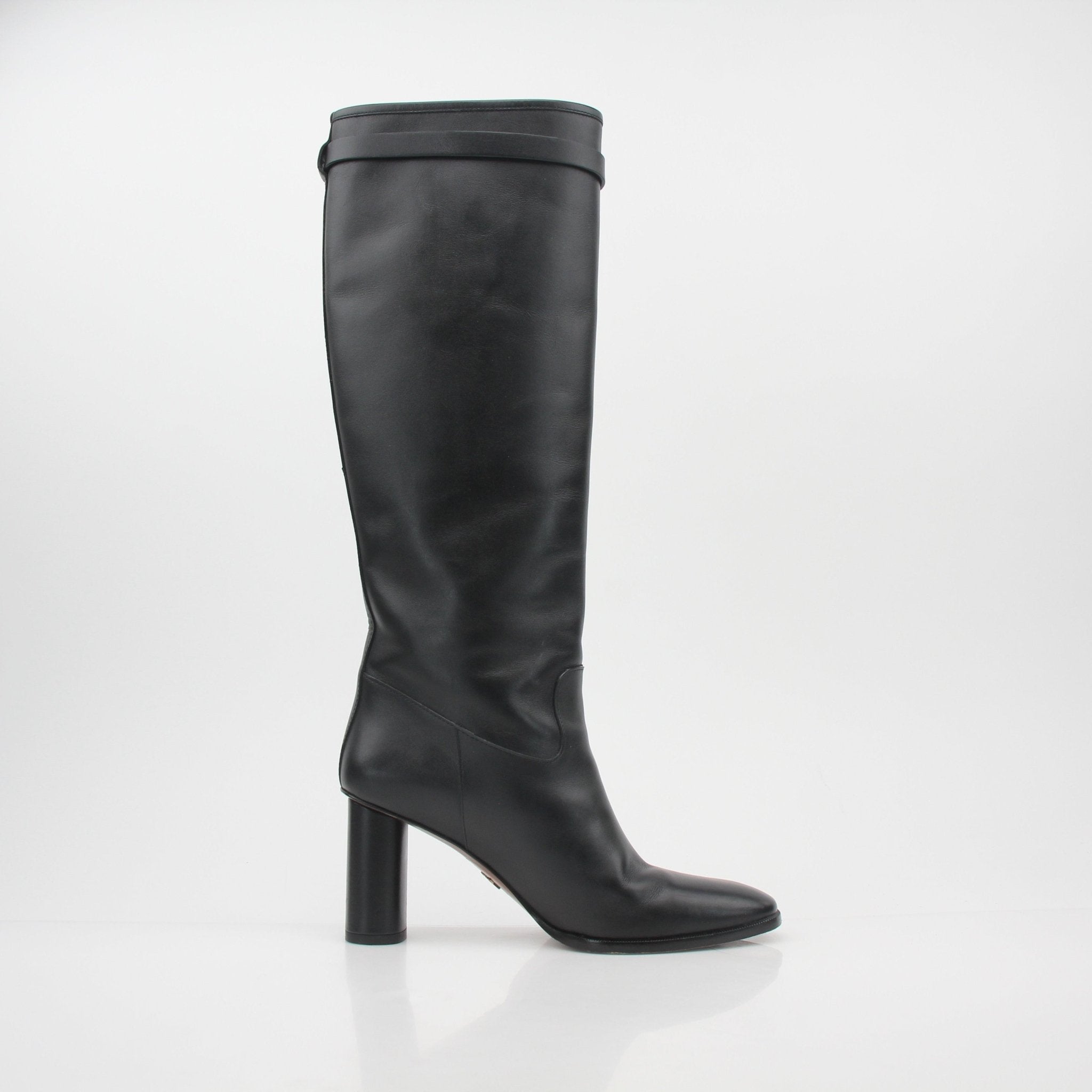 Christian Dior Black Leather Empreinte heeled boots, stylish shoes with embossed pattern and sleek design, displayed on a neutral background.