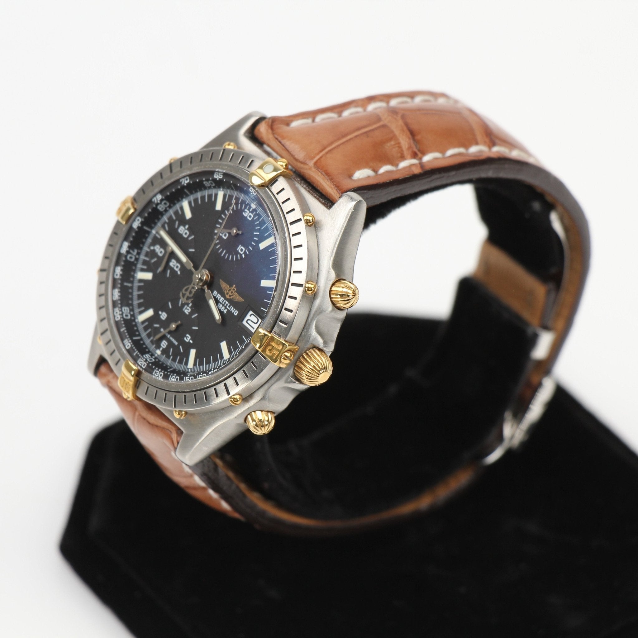 Gold & Beyond Breitling Chronomat 81 watch with stainless steel case, black dial, and chronograph features.