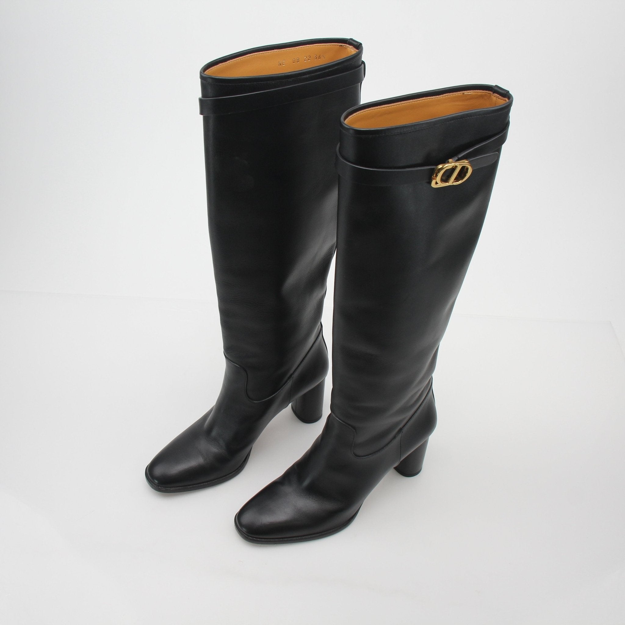 Christian Dior Black Leather Empreinte heeled boots, stylish shoes with textured leather and elegant design.