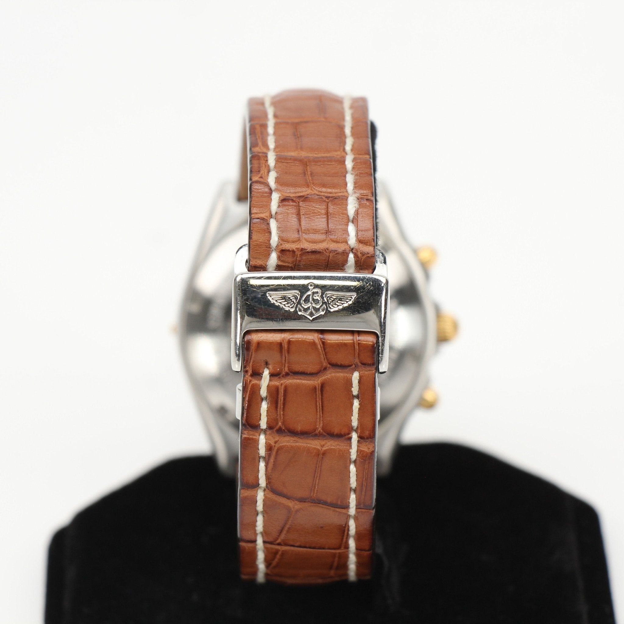 Gold & Beyond Breitling Chronomat 81 watch with stainless steel case and black dial, featuring chronograph subdials and silver-tone hands.