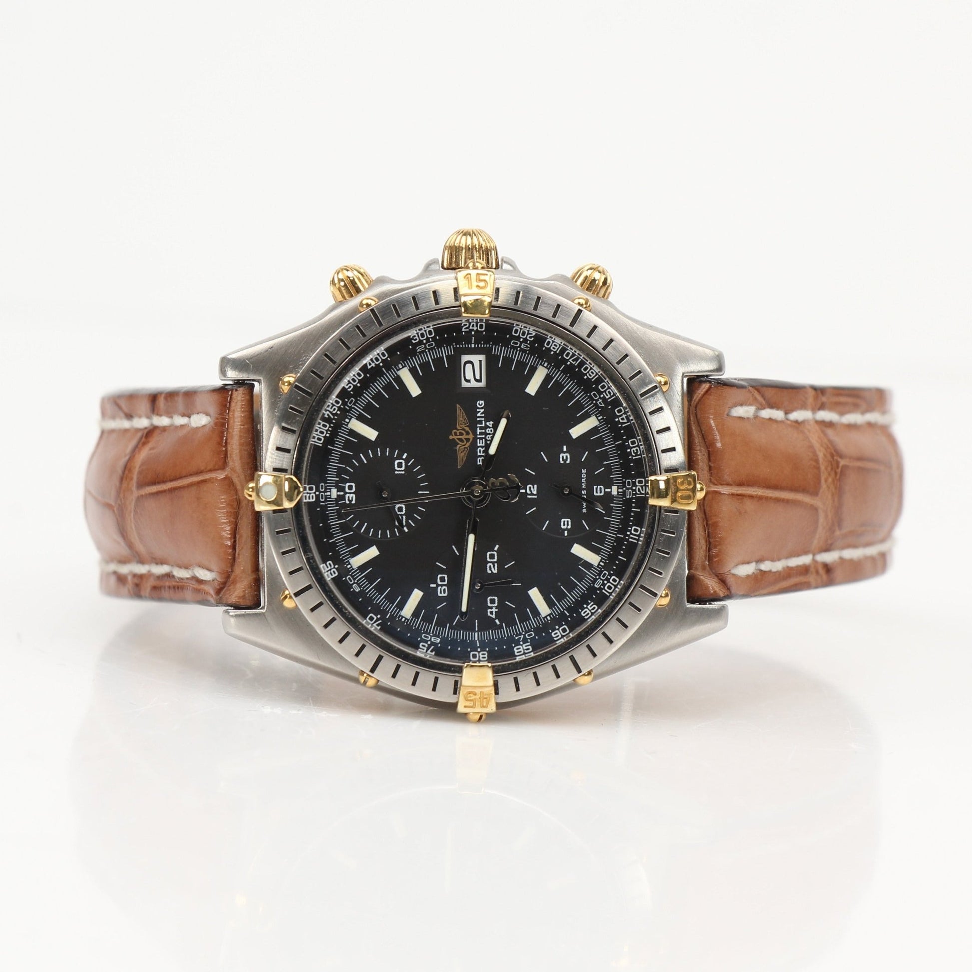 Gold & Beyond Breitling Chronomat 81 watch with black dial, stainless steel bracelet, and chronograph features.