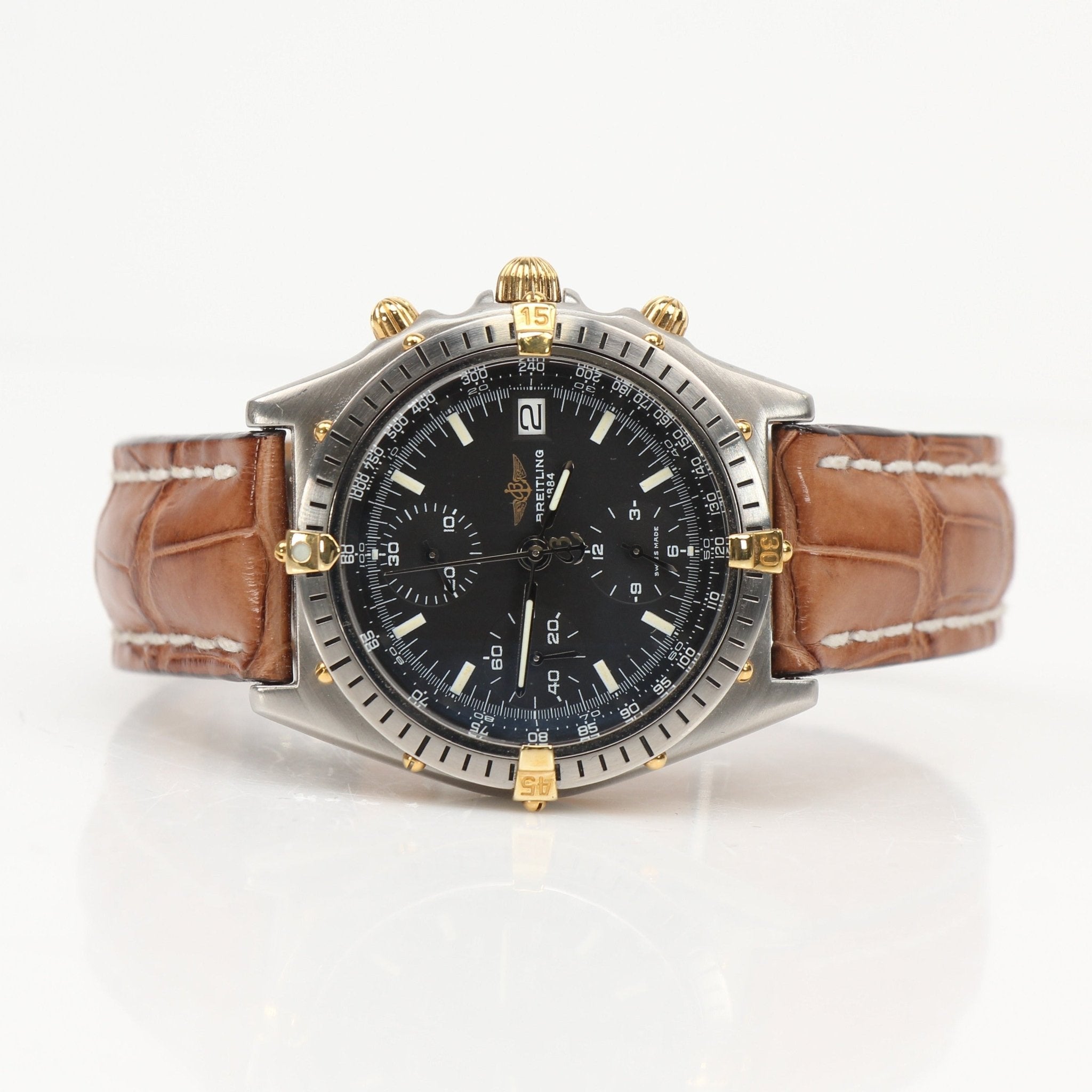 Gold & Beyond Breitling Chronomat 81 watch with black dial, stainless steel bracelet, and chronograph features.