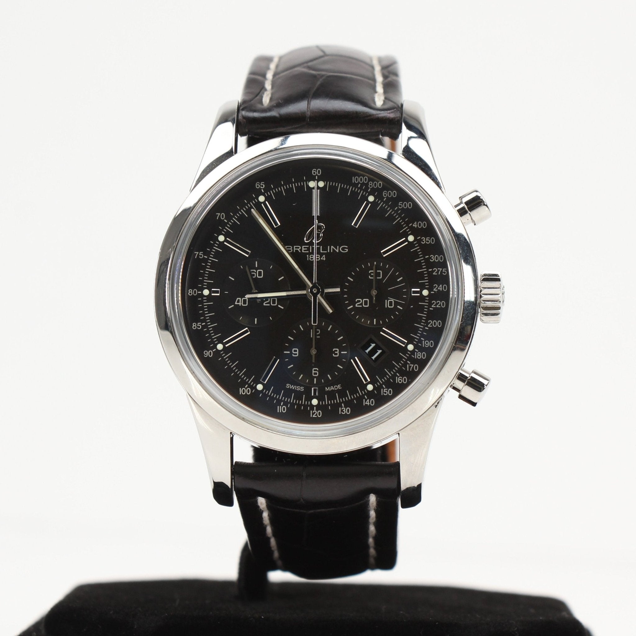 Gold & Beyond Breitling automatic chronograph watch with silver dial, stainless steel bracelet, and detailed subdials.