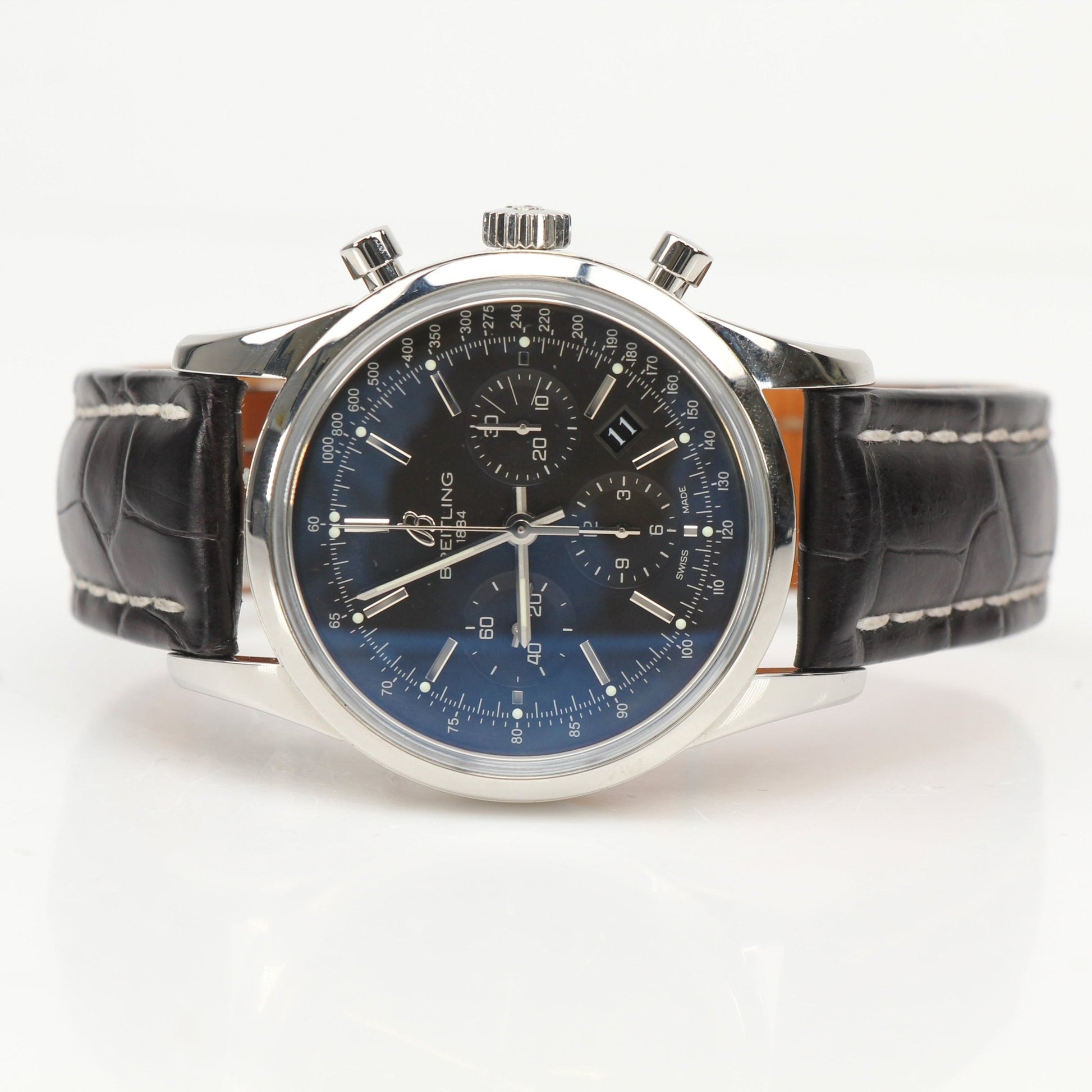 Gold & Beyond Breitling automatic chronograph watch with black dial, stainless steel case, and detailed subdials.