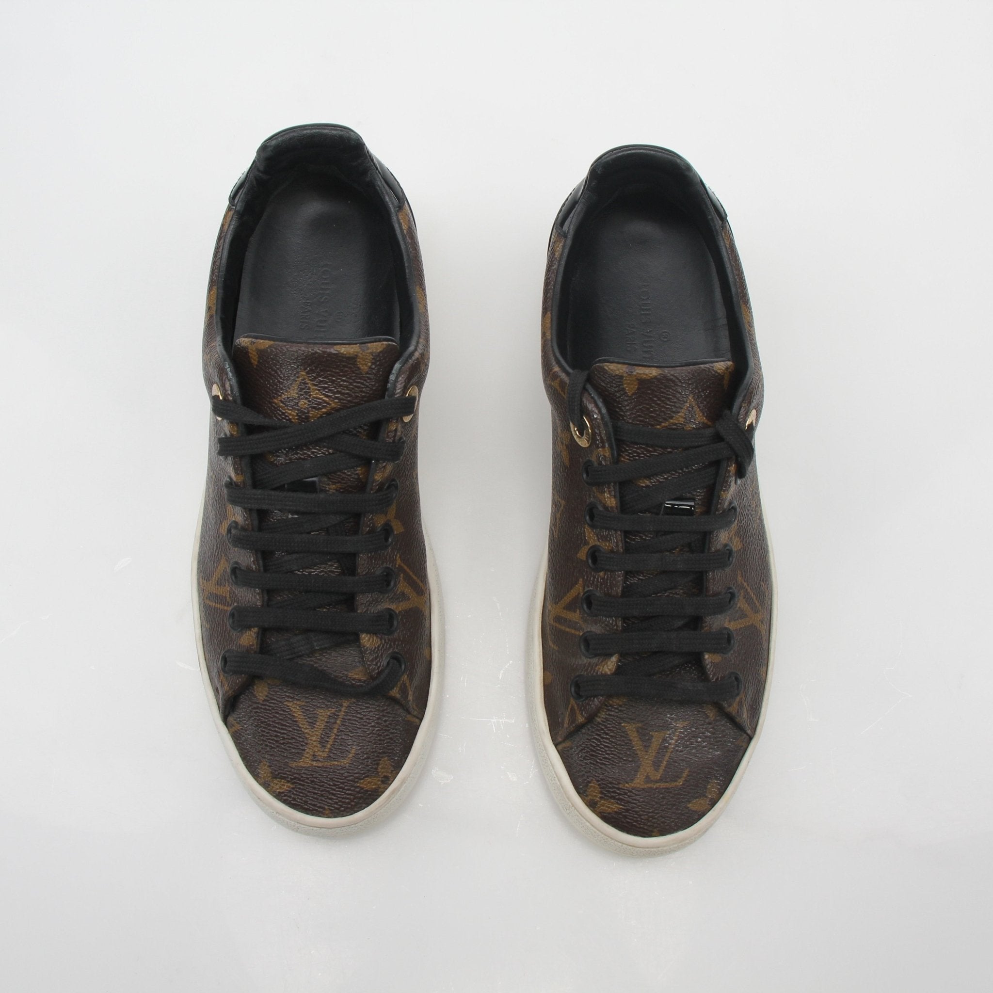 Louis Vuitton Monogram Frontrow low top sneakers by Gold & Beyond, featuring the signature monogram pattern and casual shoe design.