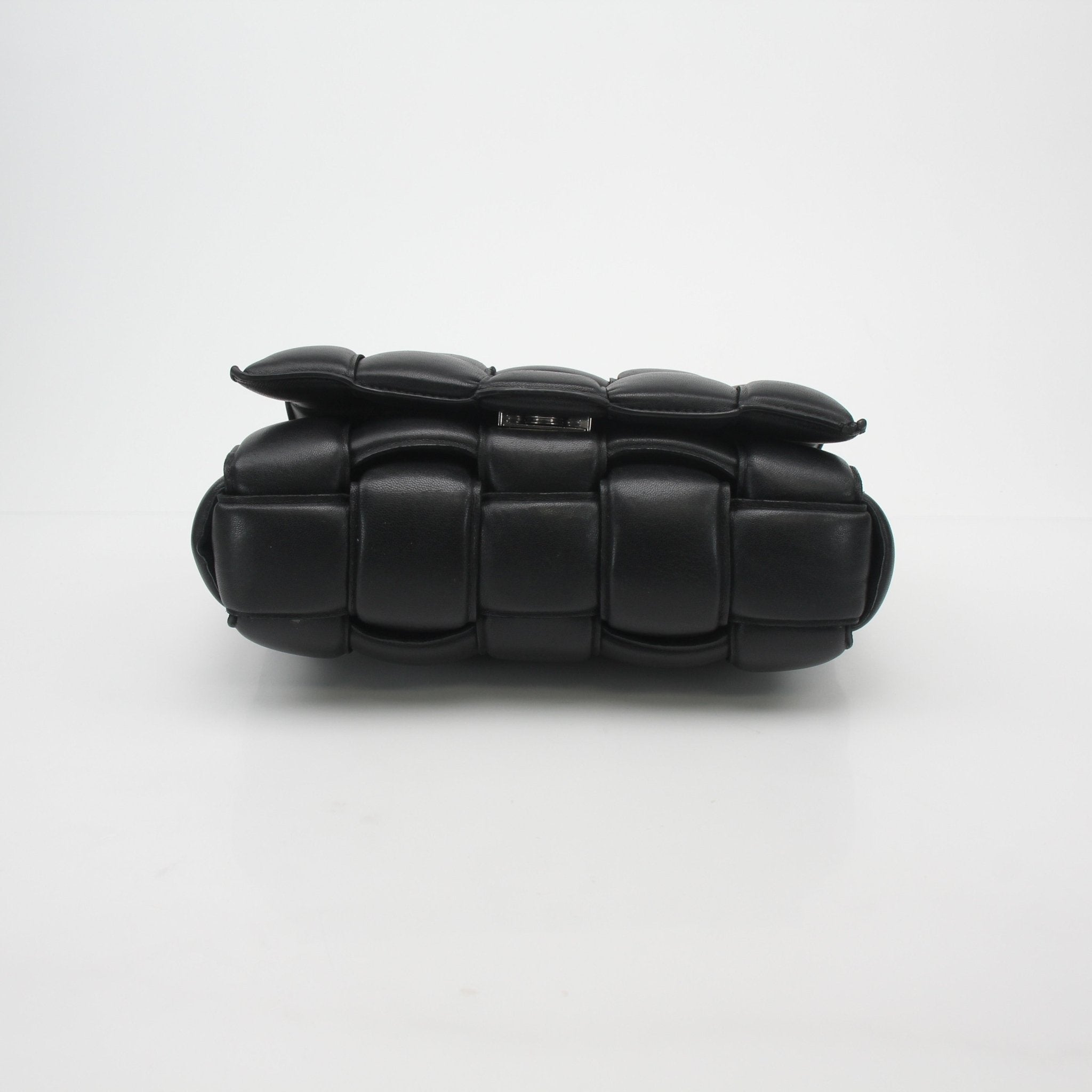 Black Bottega Veneta padded cassette chain shoulder handbag with gold hardware, featuring a sleek design and chain strap.