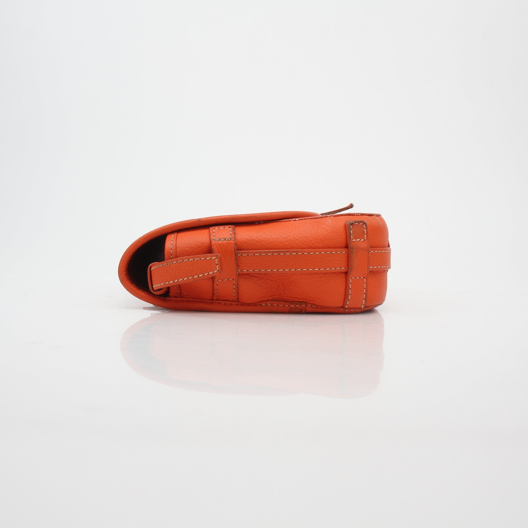 Orange Goyardine Belvédère II PM handbag by Goyard, featuring gold hardware and woven pattern, displayed on a neutral background.