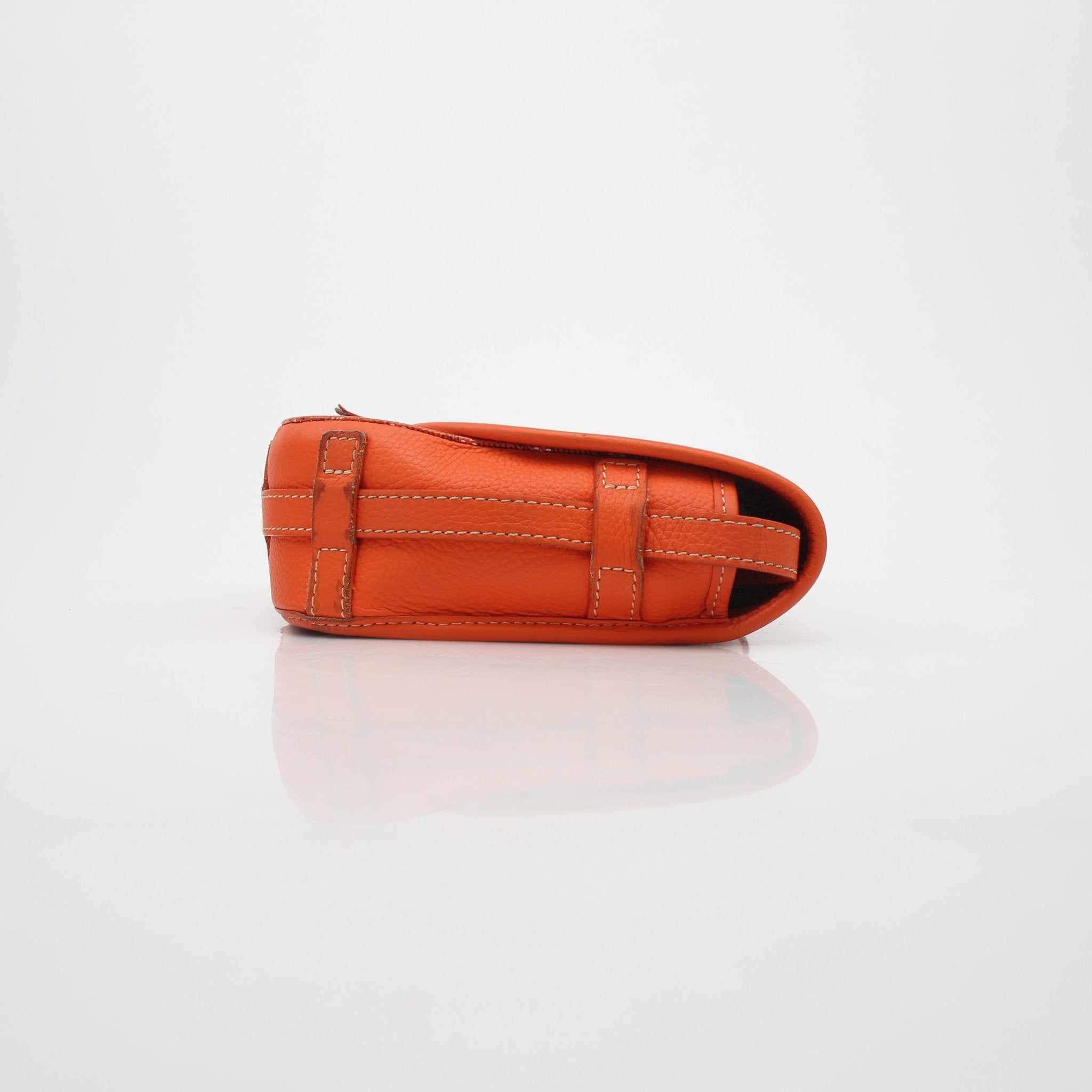 Orange Goyardine Belvédère II PM handbag by Goyard, featuring gold hardware and structured design, shown in a close-up view.