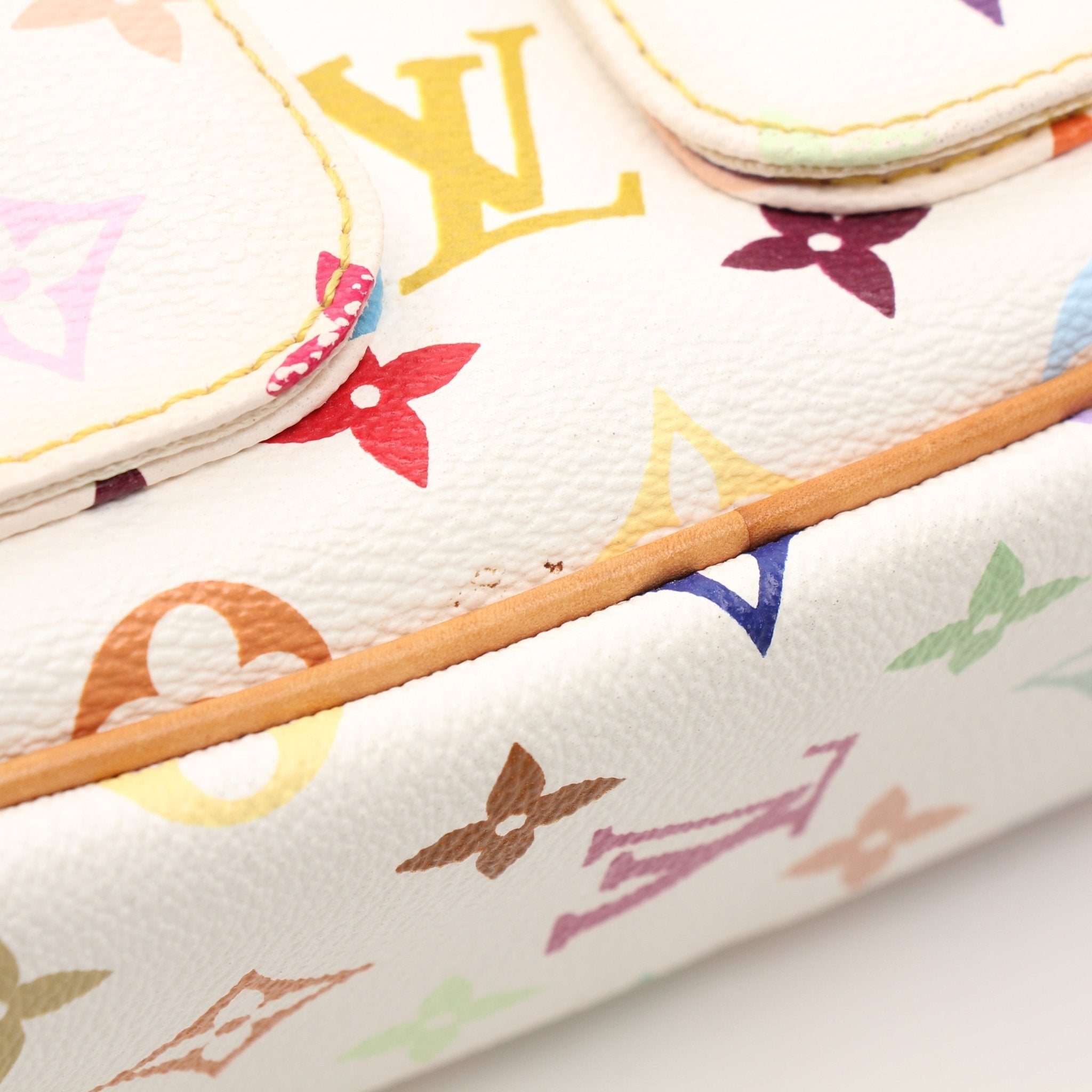 White Louis Vuitton Lodge PM shoulder handbag with gold hardware, featuring a structured design and adjustable strap.