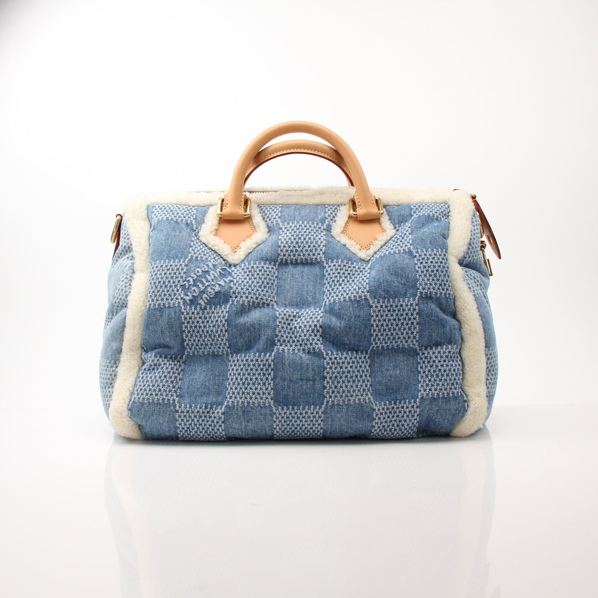 Louis Vuitton Speedy Bandoulière 40 blue winter denim travel bag with leather accents, designed for stylish travel and everyday use.