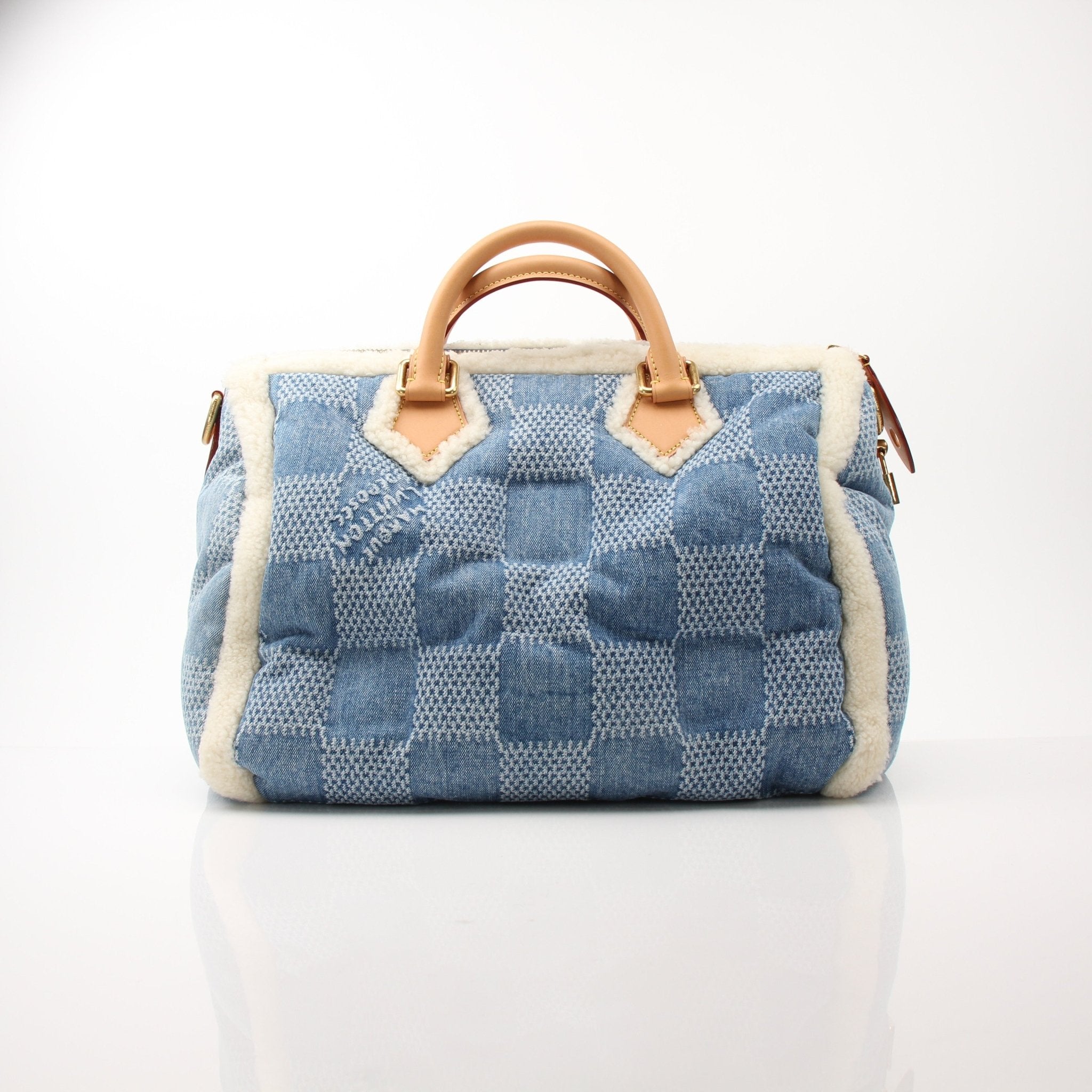 Louis Vuitton Speedy Bandoulière 40 blue winter denim travel bag with leather accents, designed for stylish travel and everyday use.