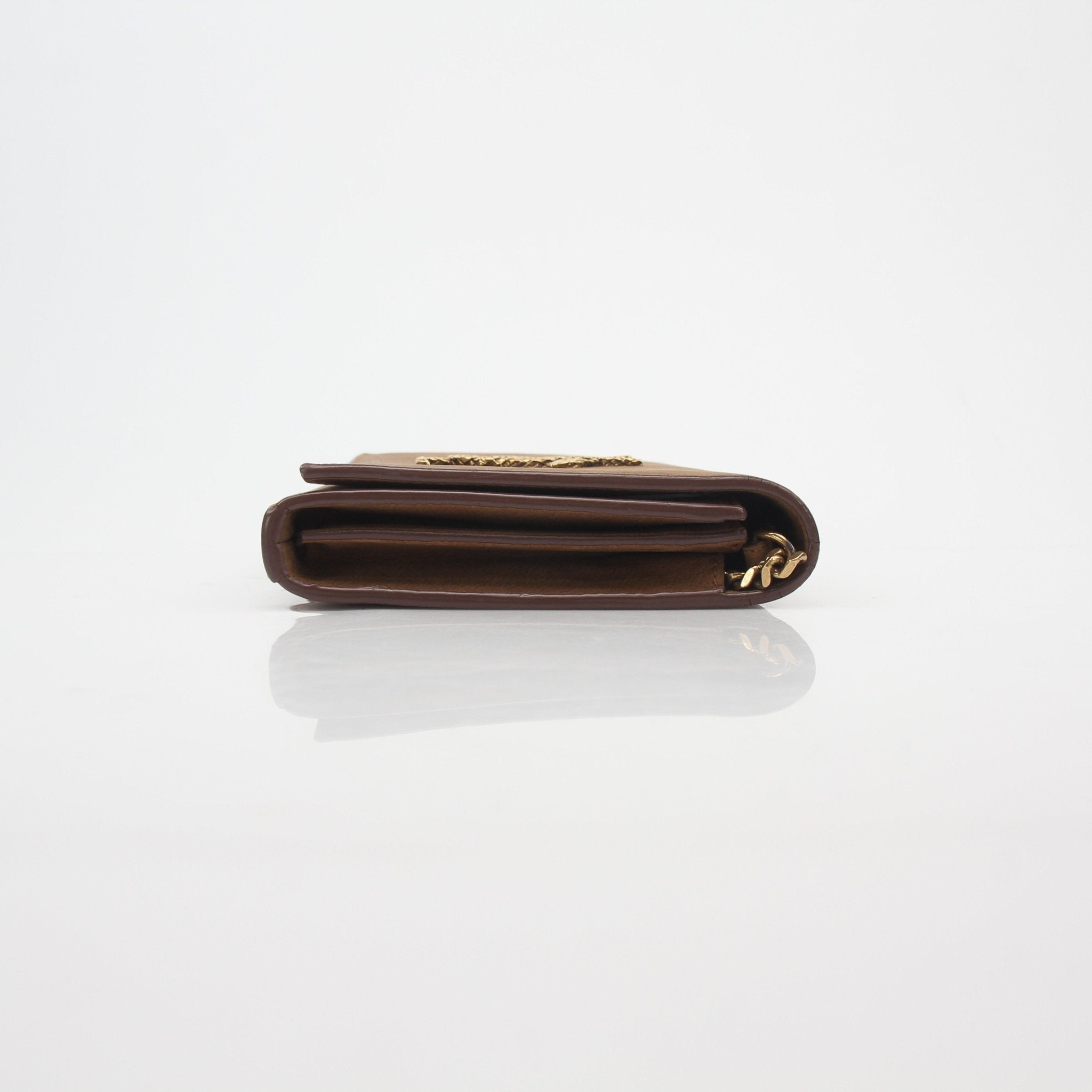 Brown suede Saint Laurent Cassandre chain wallet handbag with gold hardware and signature design.