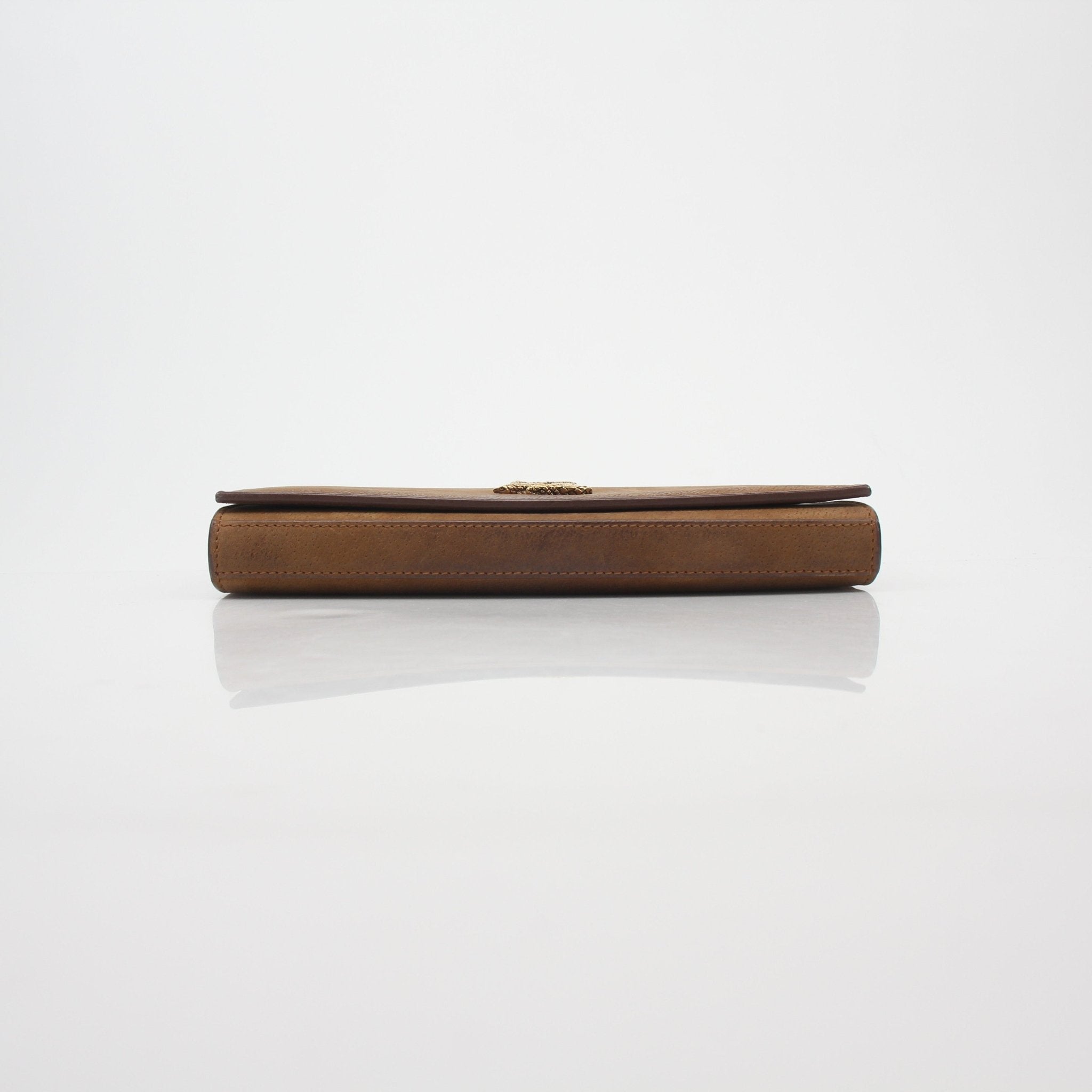 Brown suede Saint Laurent Cassandre chain wallet handbag with gold hardware and compact design.