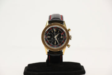 Vintage Gold & Beyond bezelmeter chronograph wristwatch with classic WW2 design and leather strap.