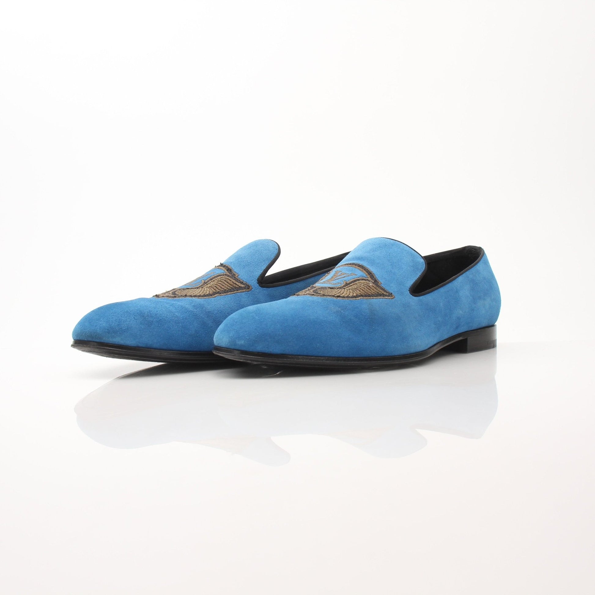 Gold & Beyond blue suede Louis Vuitton embroidered slip-on loafers with stylish design and intricate embroidery details.