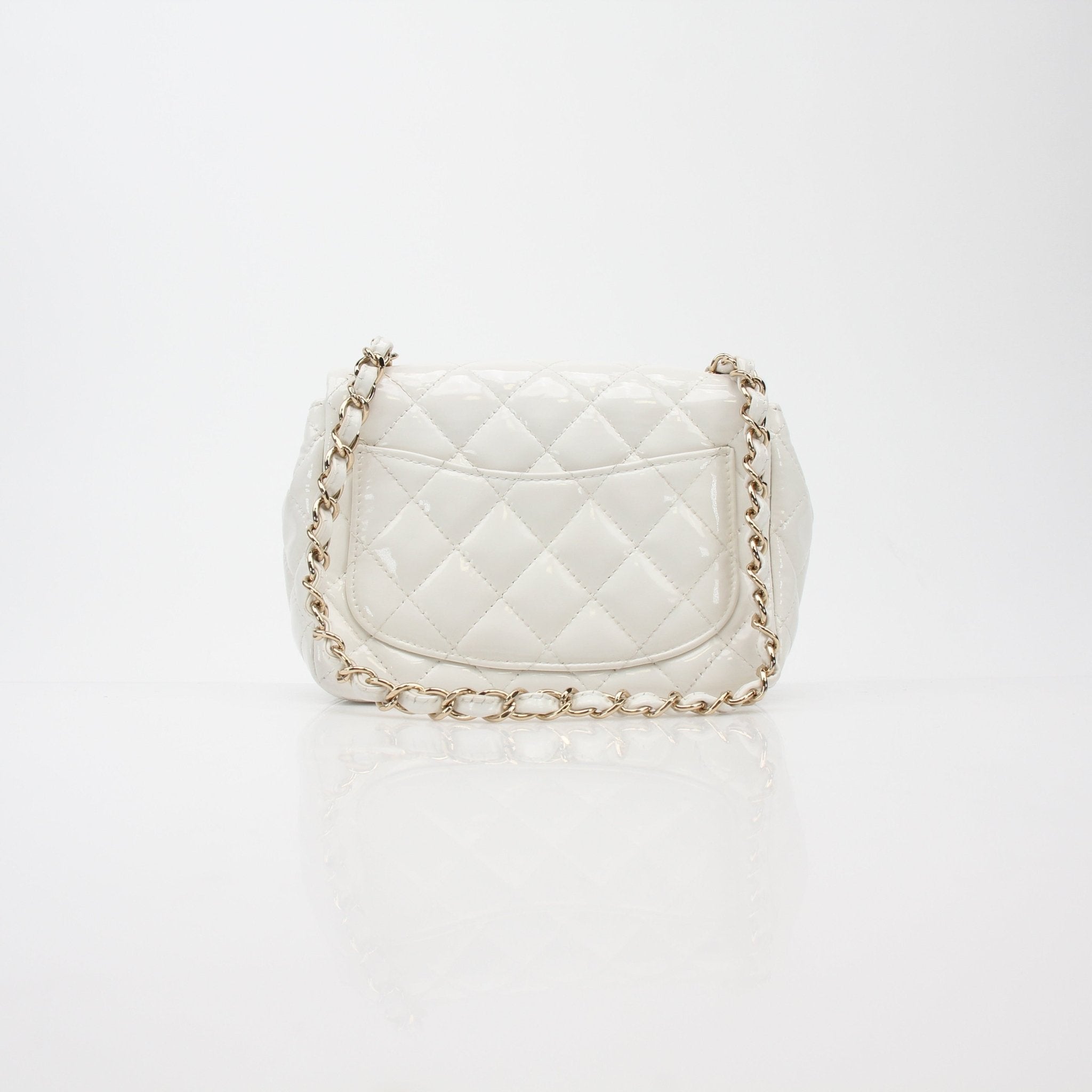 Gold & Beyond Chanel Quilted Patent Leather Mini Flap Bag, stylish handbag with gold hardware and quilted design.