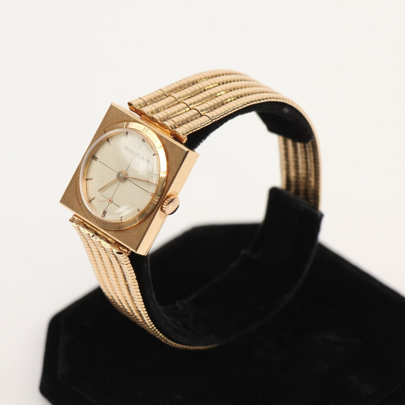 Elegant Jaeger-LeCoultre gold dress watch with a sleek design, featuring a gold case and refined leather strap.