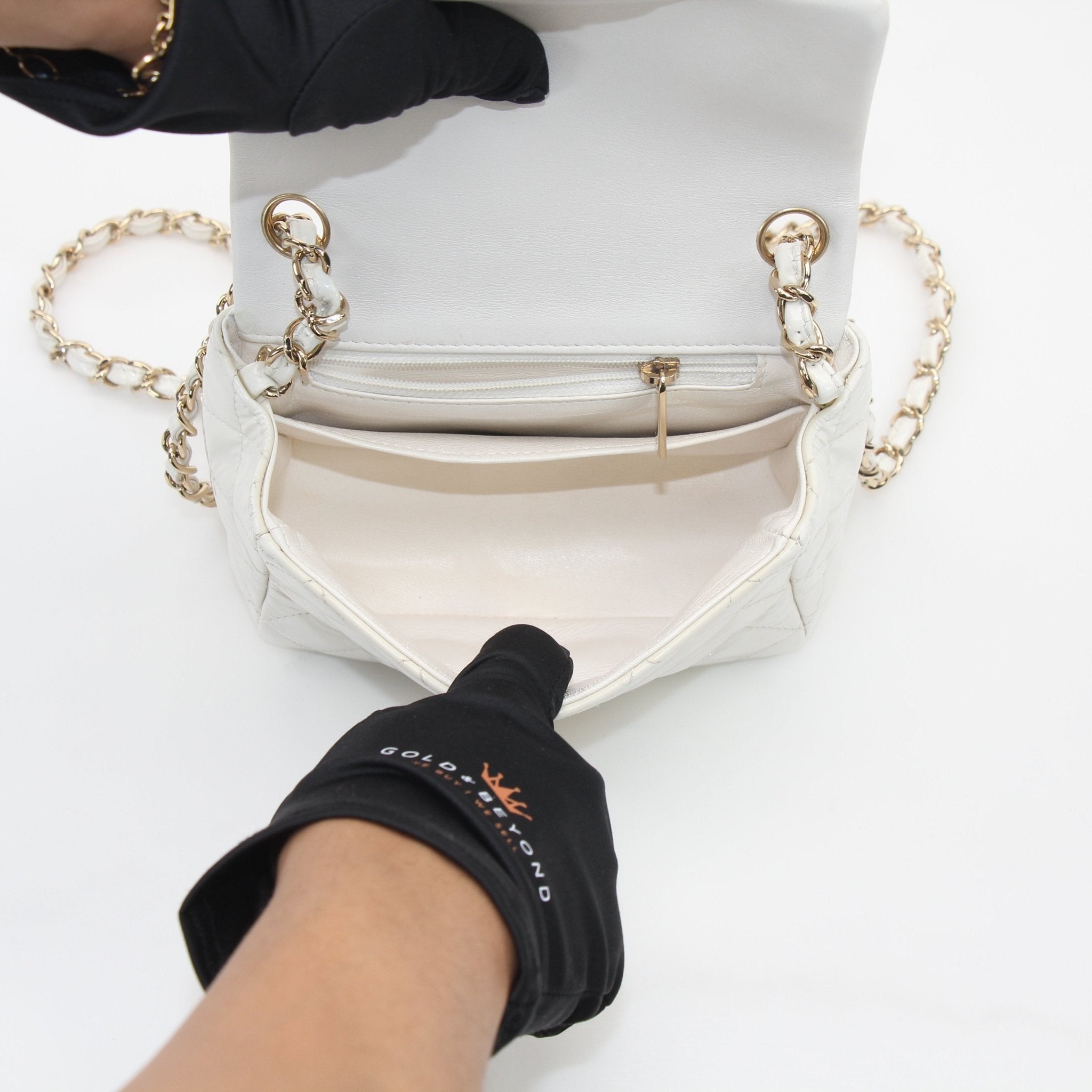 Gold & Beyond Chanel Quilted Patent Leather Mini Flap Bag handbag with gold chain strap and classic quilted design.