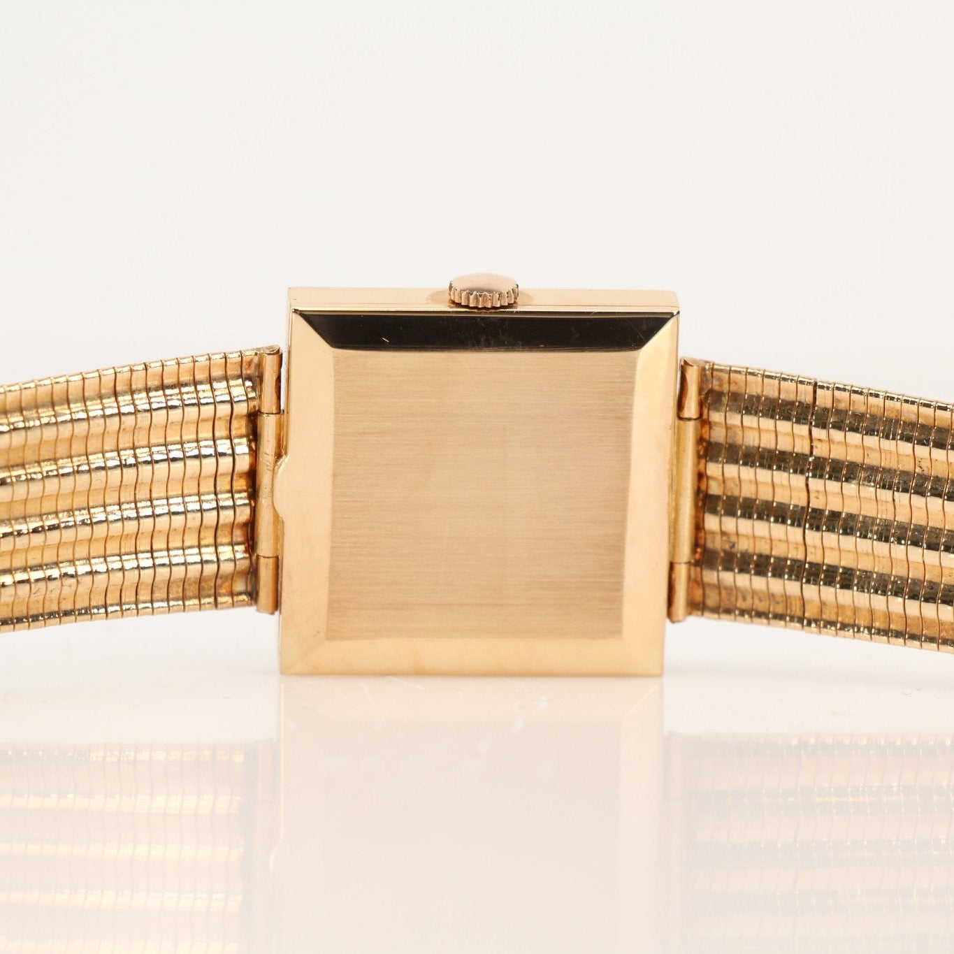 Elegant Jaeger-LeCoultre gold dress watch with a sleek round face and gold band, showcasing luxury watch craftsmanship.