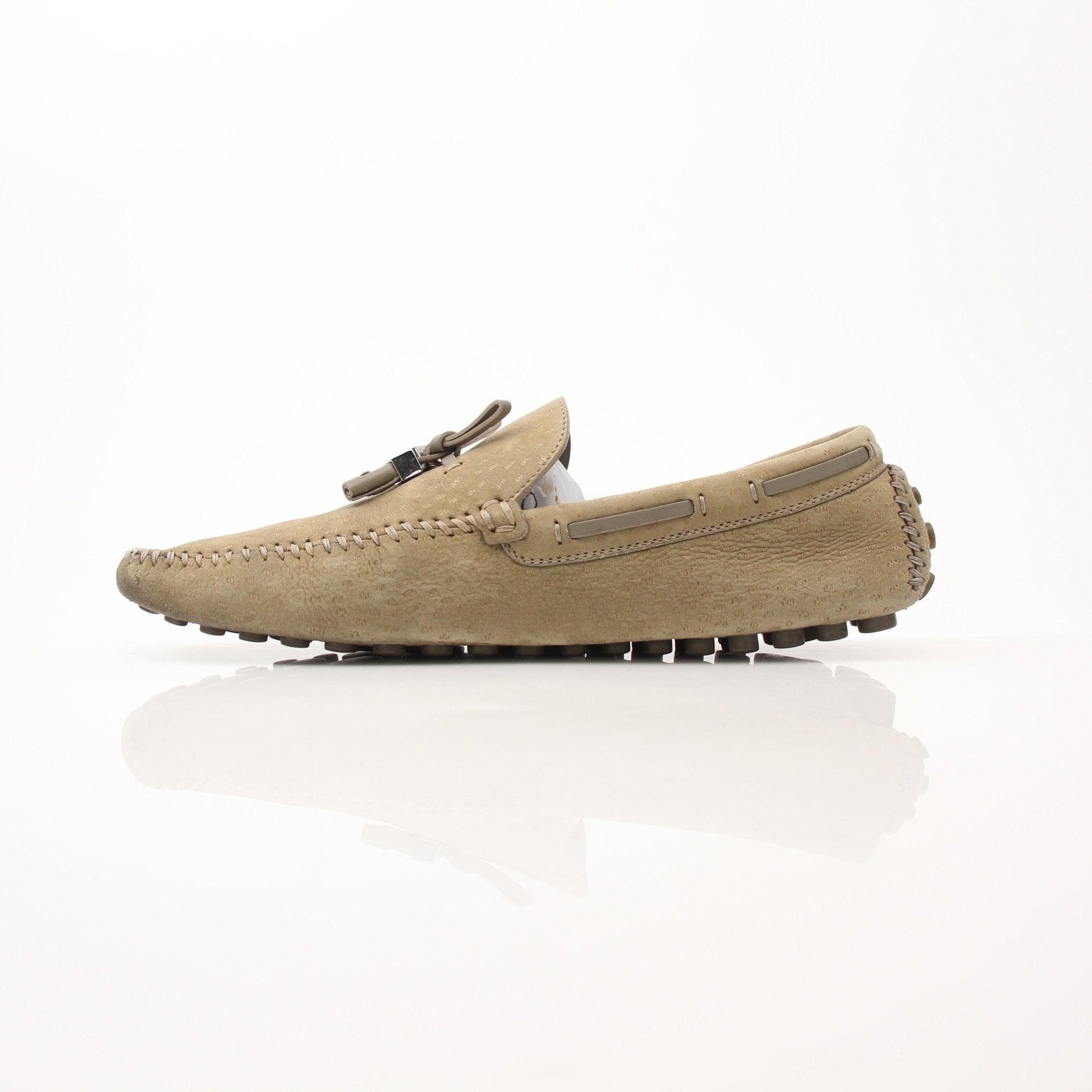 Louis Vuitton LV Driver Moccasins in beige suede, stylish loafers with classic design, shown in a close-up image of the shoes.