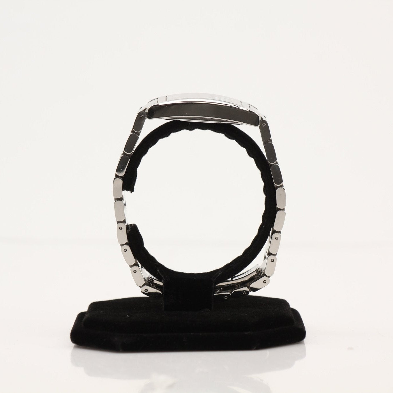 Movado Museum Classic watch with gold-tone case and black leather strap, showcasing minimalist design and iconic Museum dial.