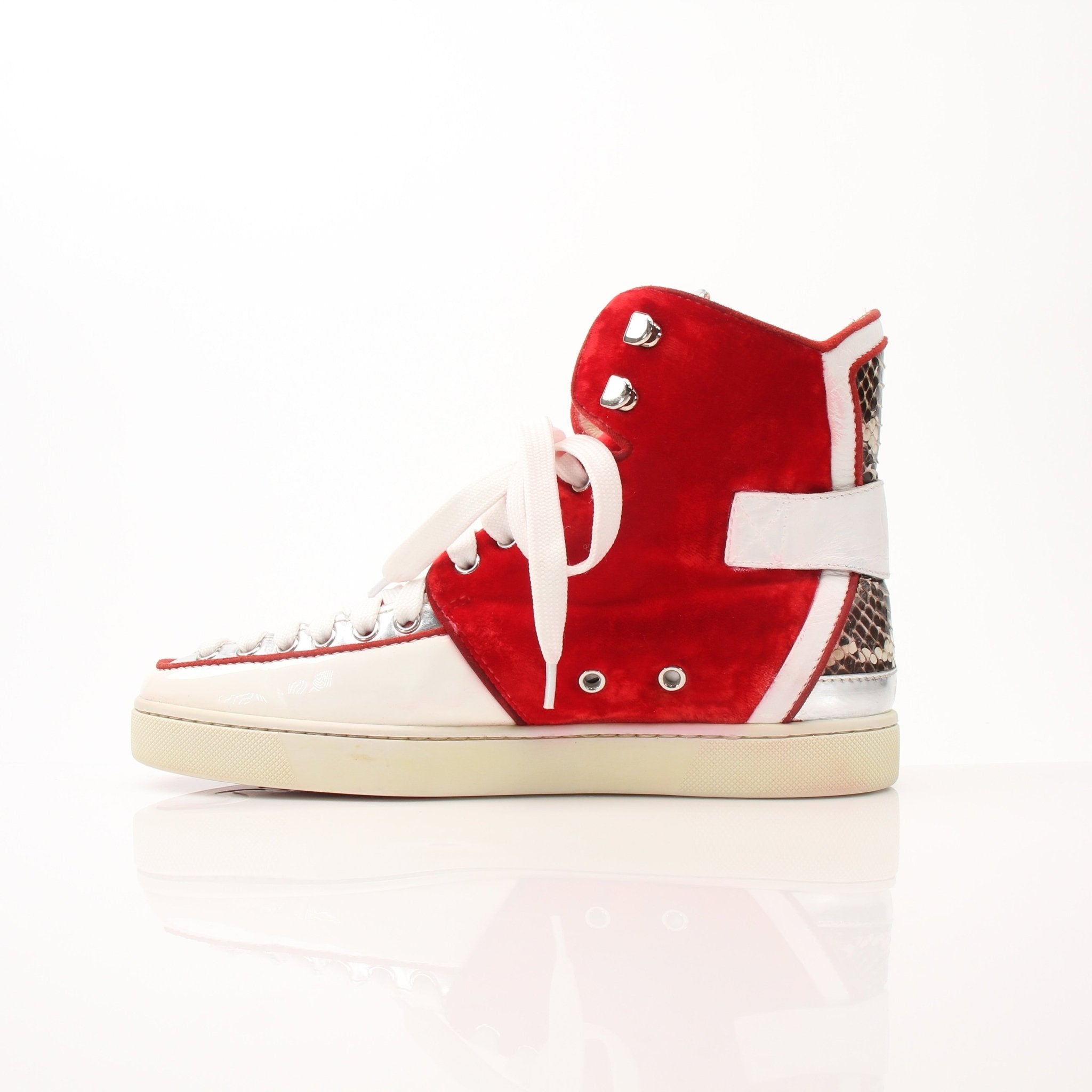 Christian Louboutin men’s Python Alfie high-top sneakers with red velvet accents and stylish design, displayed on a plain background.