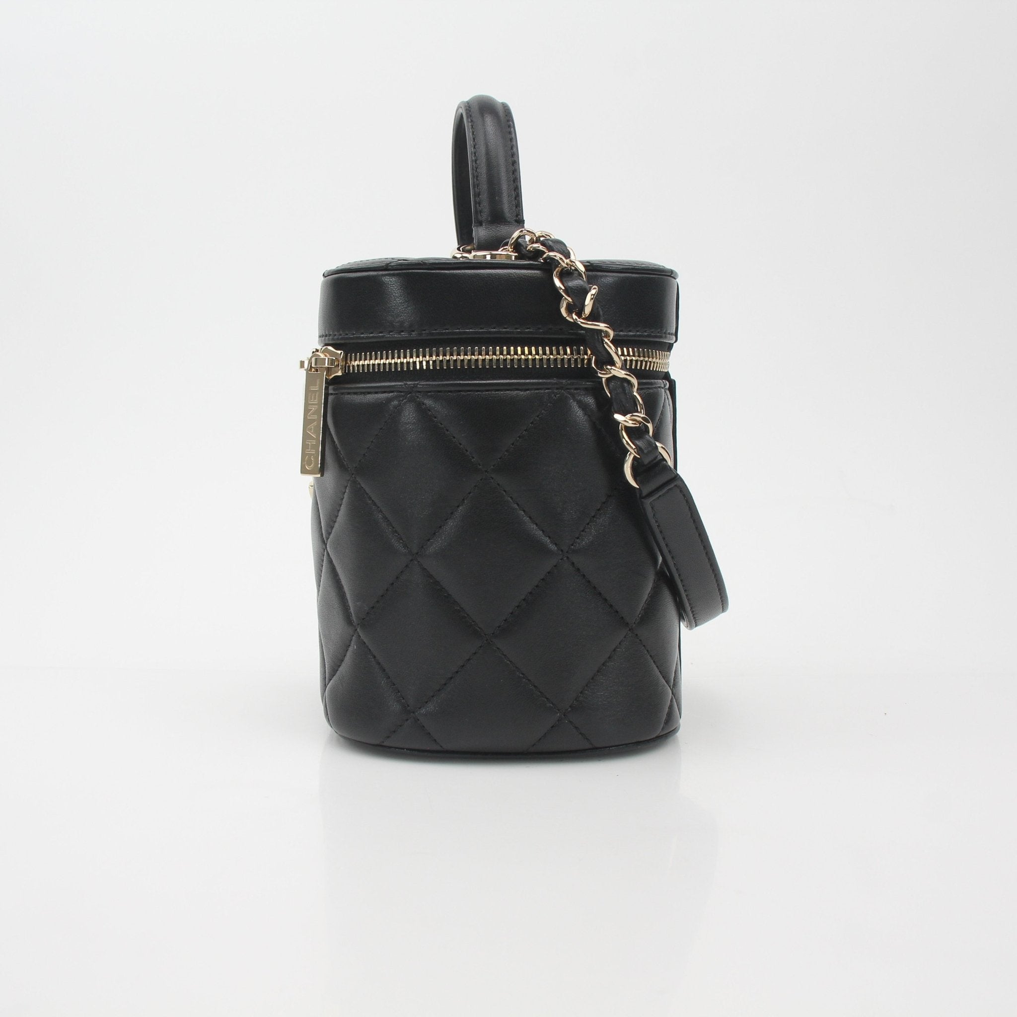 Gold & Beyond Chanel quilted lambskin vanity case handbag with gold hardware and compact design, showcasing luxurious craftsmanship.