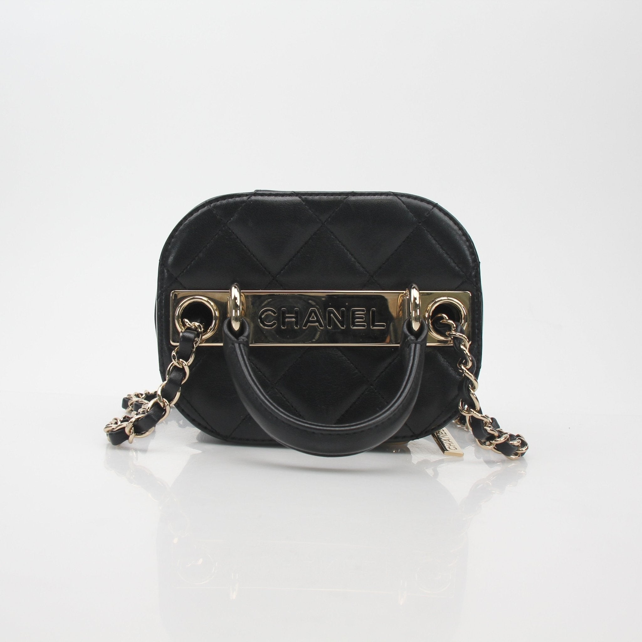 Gold & Beyond quilted lambskin vanity case with gold-tone hardware, compact design, and luxurious texture.