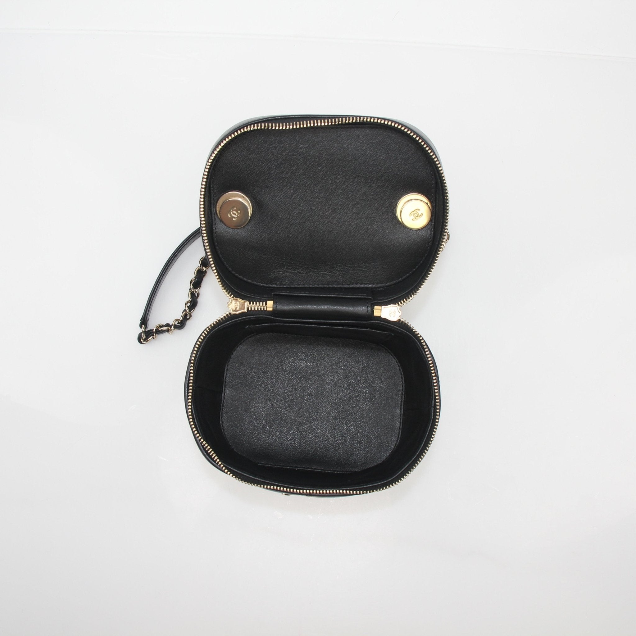 Gold & Beyond Chanel quilted lambskin vanity case handbag with gold hardware, compact and stylish for travel and accessories.
