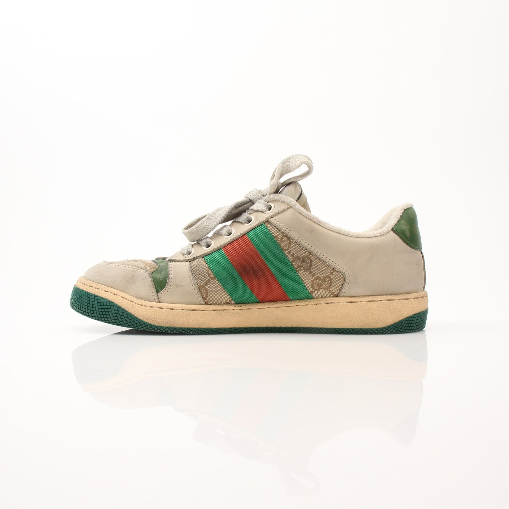 Gold & Beyond Gucci men's distressed effect Screener sneakers, stylish casual shoes with a worn-in look and modern design.