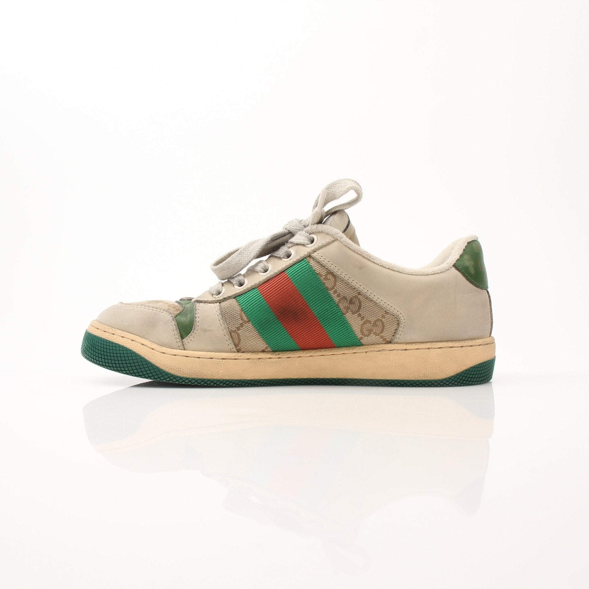 Gold & Beyond Gucci men's distressed effect Screener sneakers, stylish casual shoes with a worn-in look and modern design.