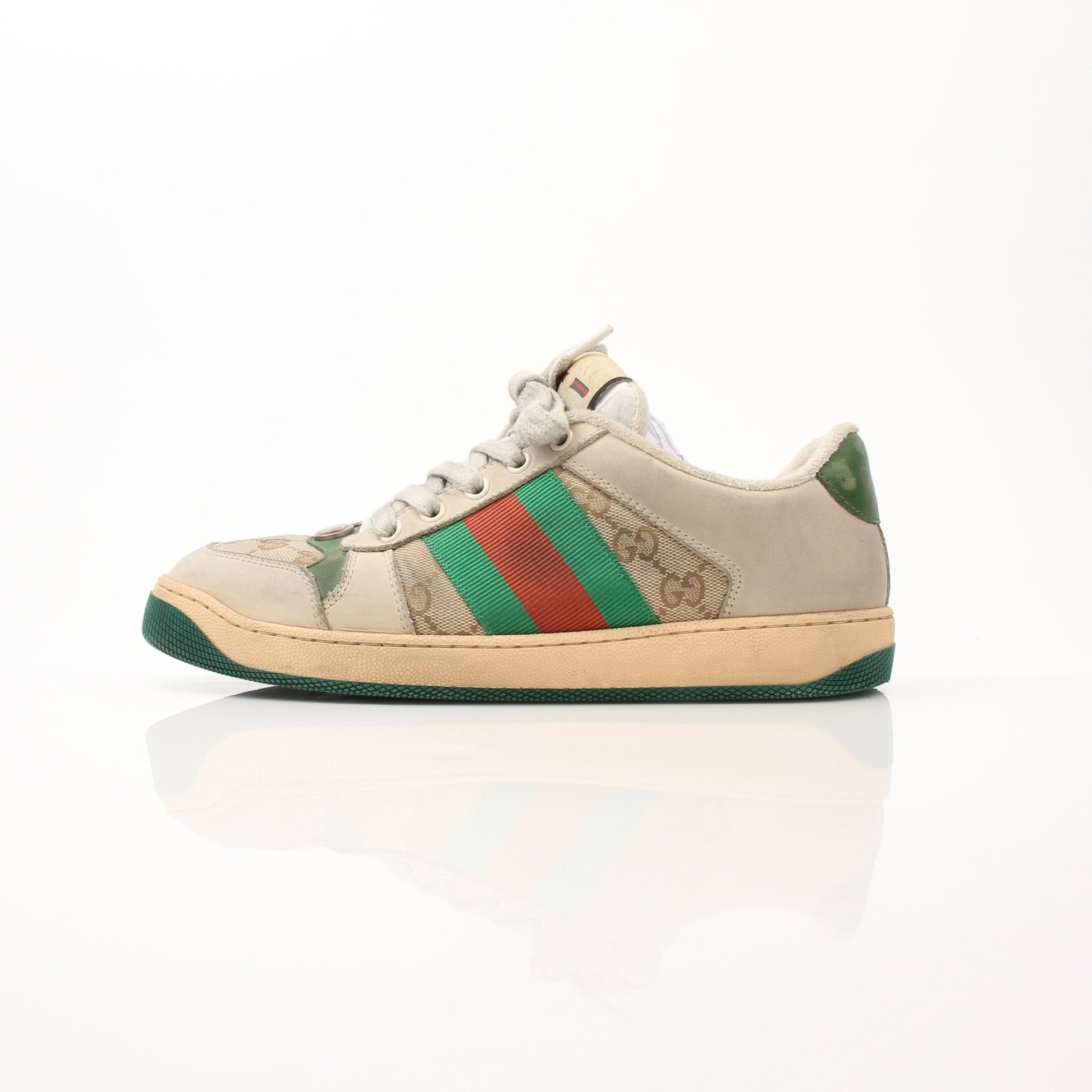 Gold & Beyond Gucci men's distressed effect Screener sneakers, stylish casual shoes with worn-in look and modern design.