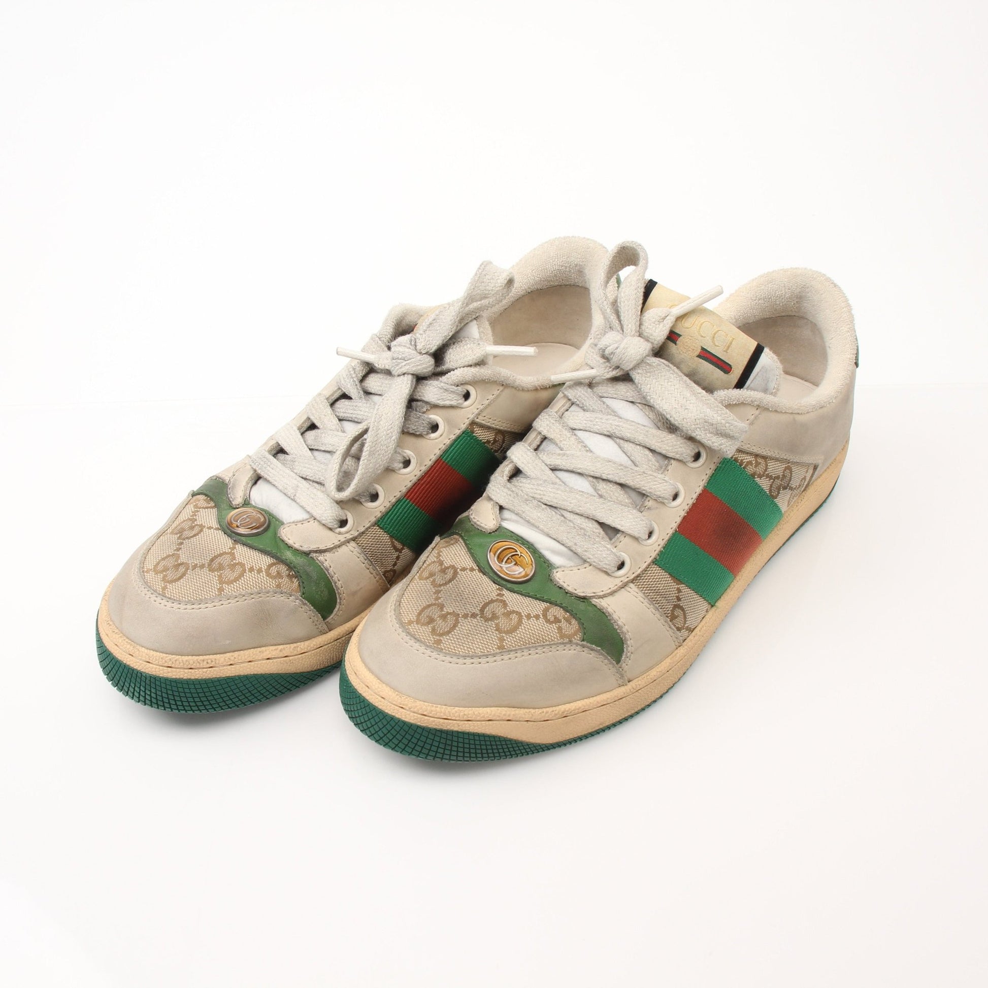 Gold & Beyond Gucci men's distressed effect screener sneakers, casual shoes with worn-in style and modern design.
