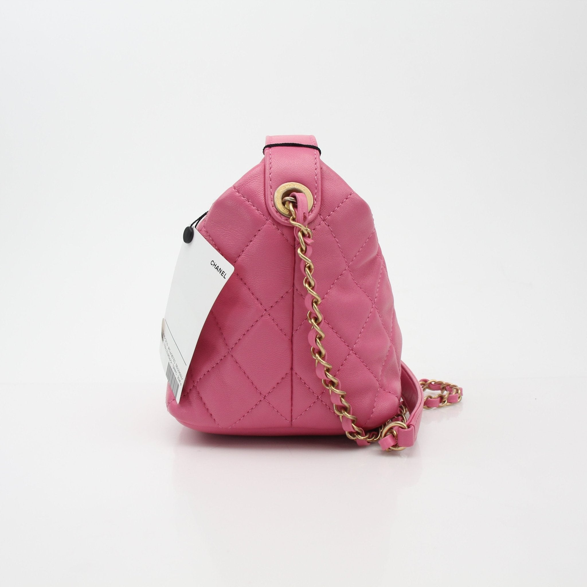 Gold & Beyond Chanel pink Perfect Meeting hobo handbag with quilted design and gold-tone hardware.
