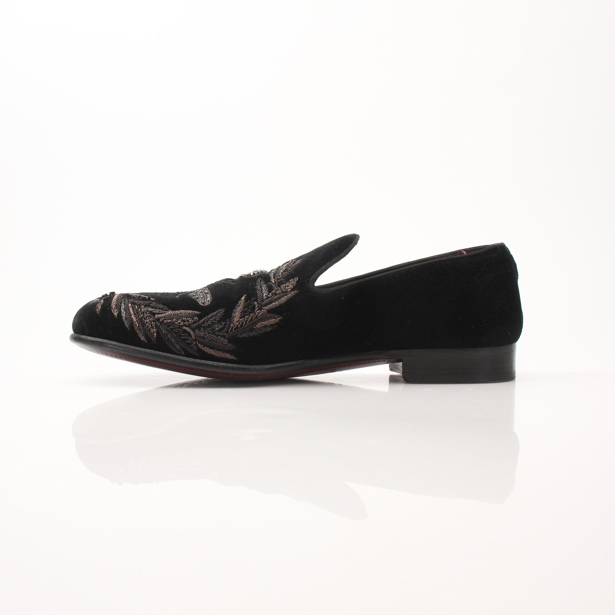 Black velvet loafers with bee and crown embroidery from Dolce & Gabbana, featuring detailed floral embellishments.