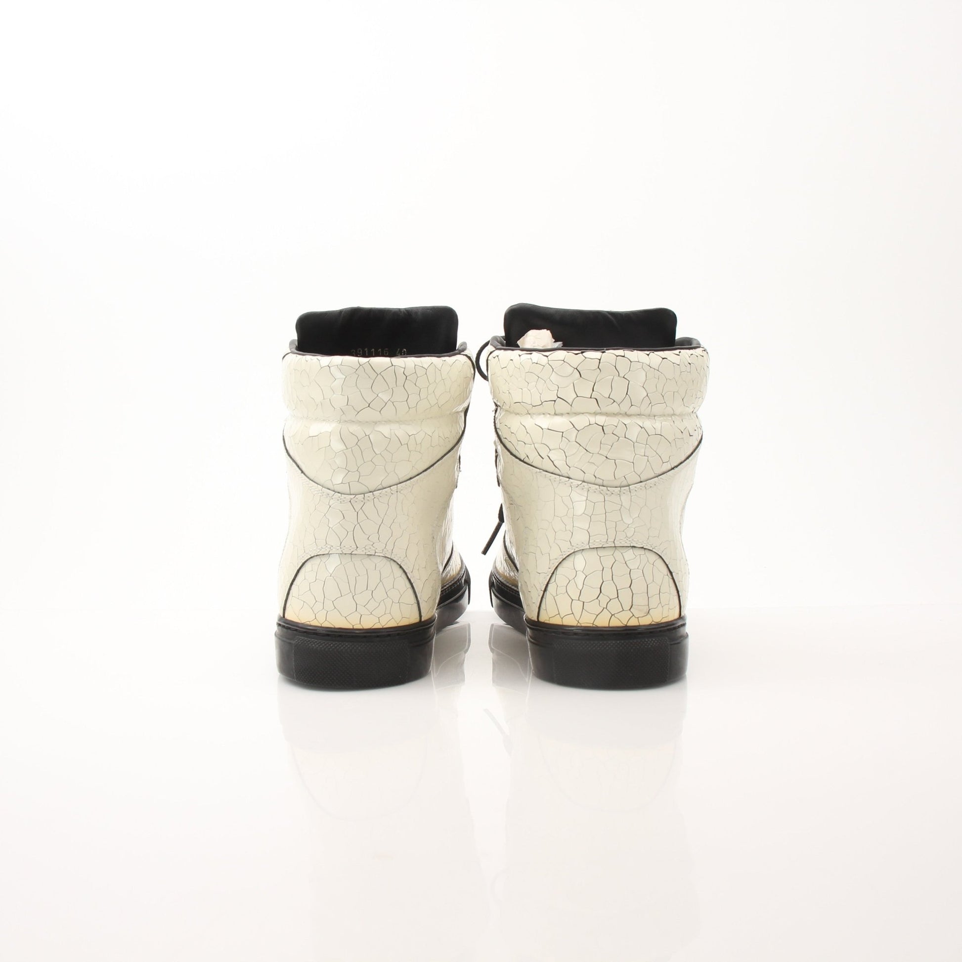 Gold & Beyond Balenciaga men’s Craquele high top sneakers with textured fabric and white rubber soles, viewed from the side.