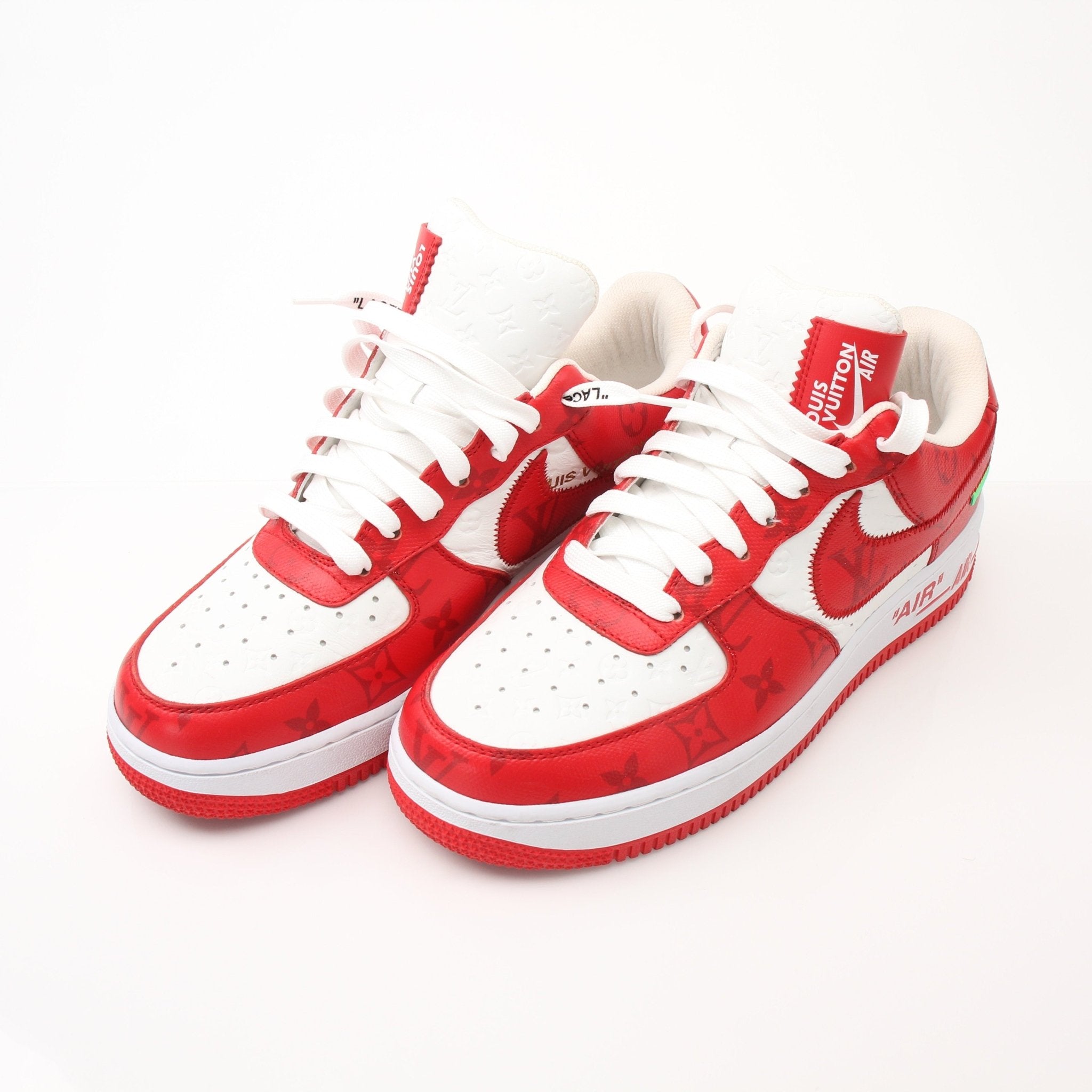 Gold & Beyond Louis Vuitton x Nike Air Force 1 Low sneakers, stylish shoes with LV and Nike branding, white and gold accents.