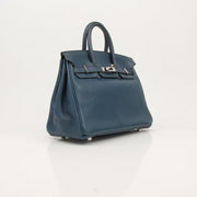 Hermès Birkin 25 blue handbag with gold hardware, featuring luxurious leather and classic design by Gold & Beyond.