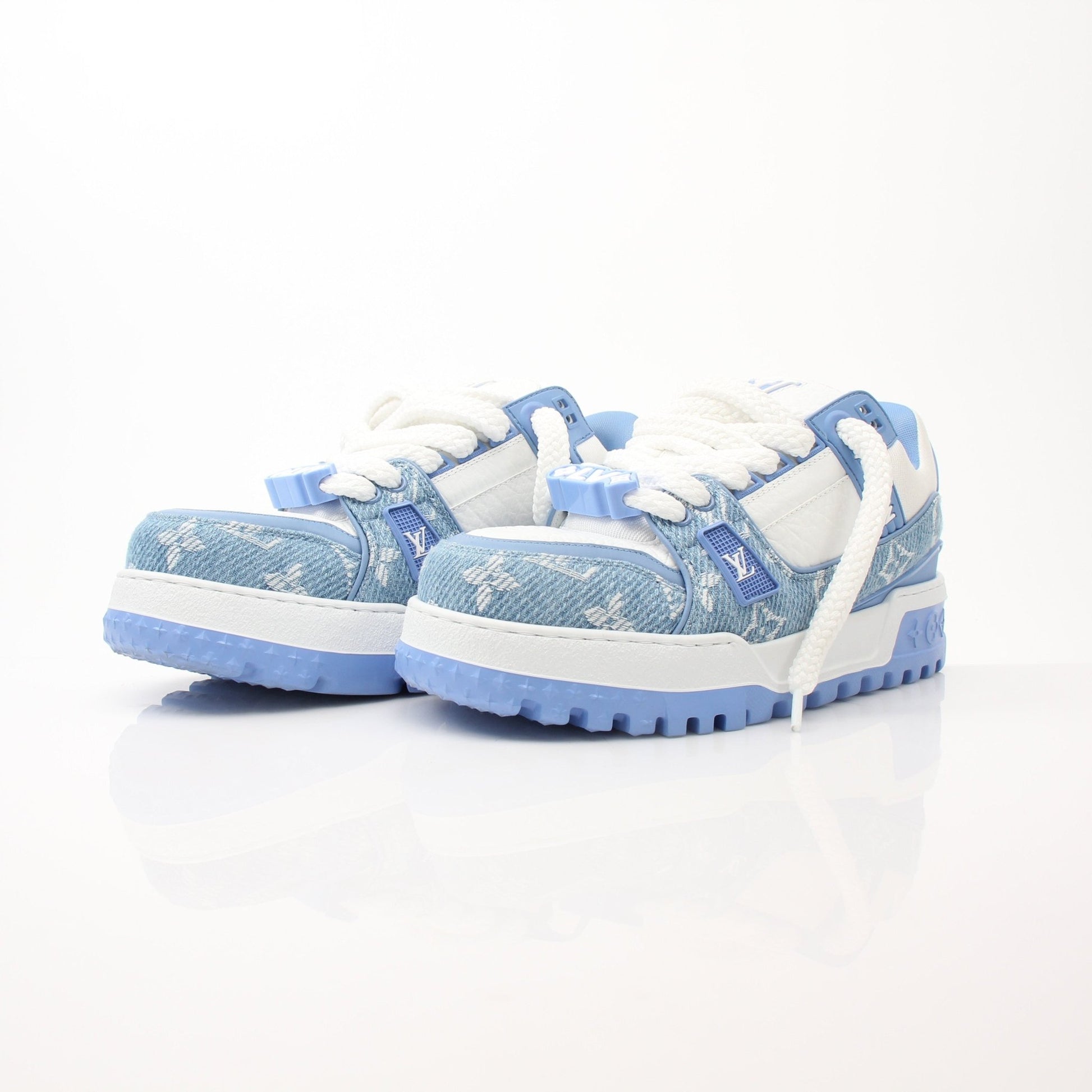Louis Vuitton Maxi Sneakers in white with gold accents, featuring lace-up design and stylish branding, by Gold & Beyond.