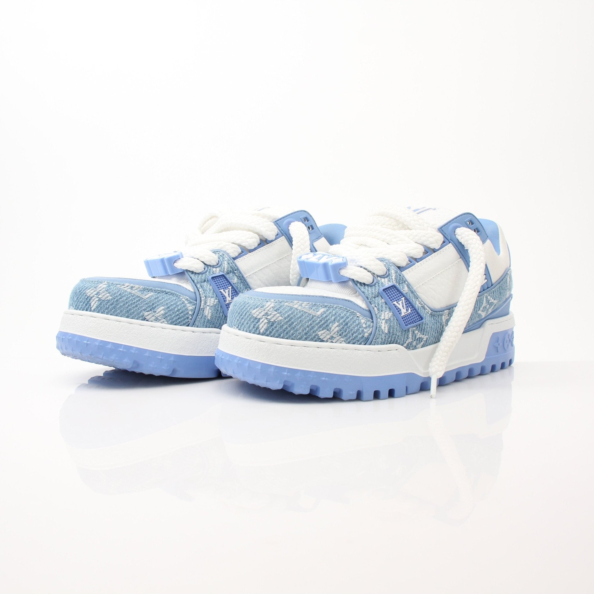 Louis Vuitton Maxi Sneakers in white with gold accents, featuring lace-up design and stylish branding, by Gold & Beyond.